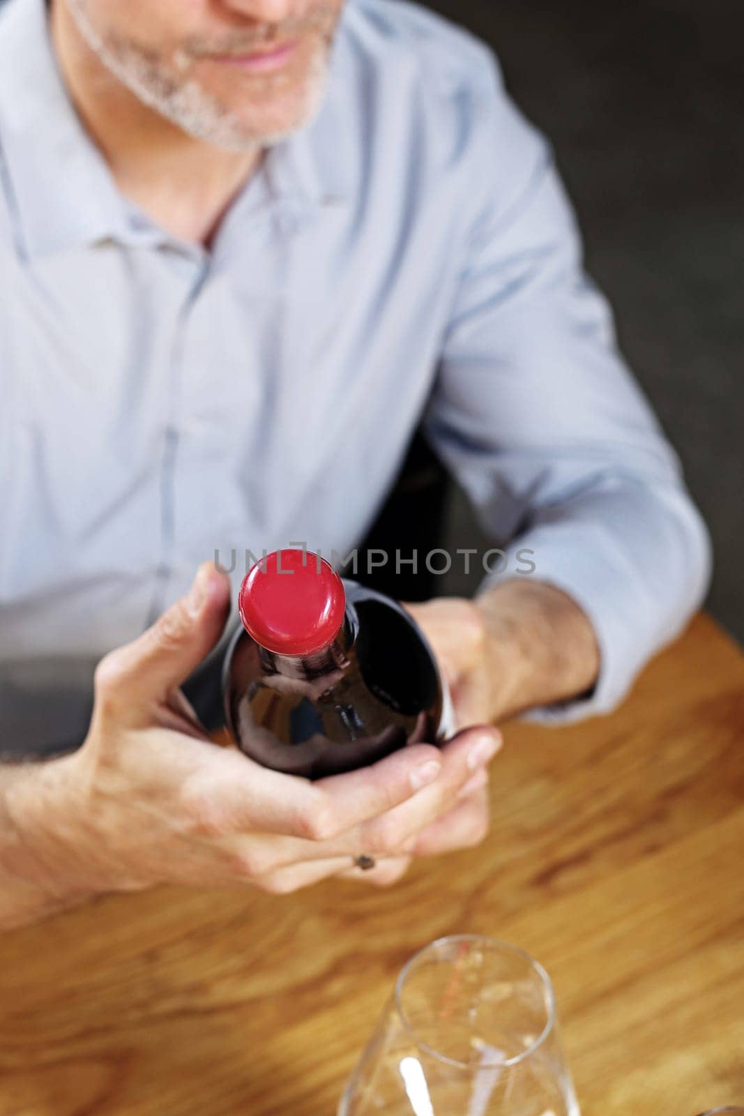 A glass of red wine. Handsome man drinking wine. Man drinking wine.