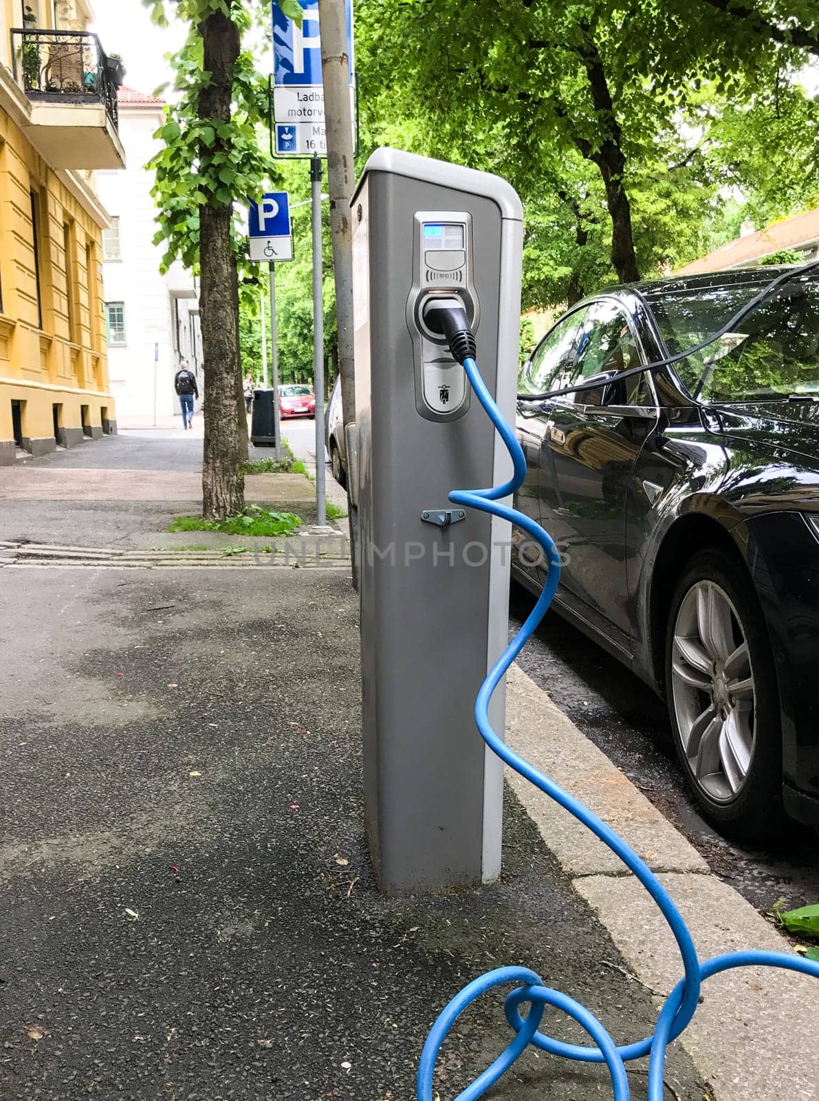 Electric car charging station in Oslo. Eco automobile that sparked a revolution