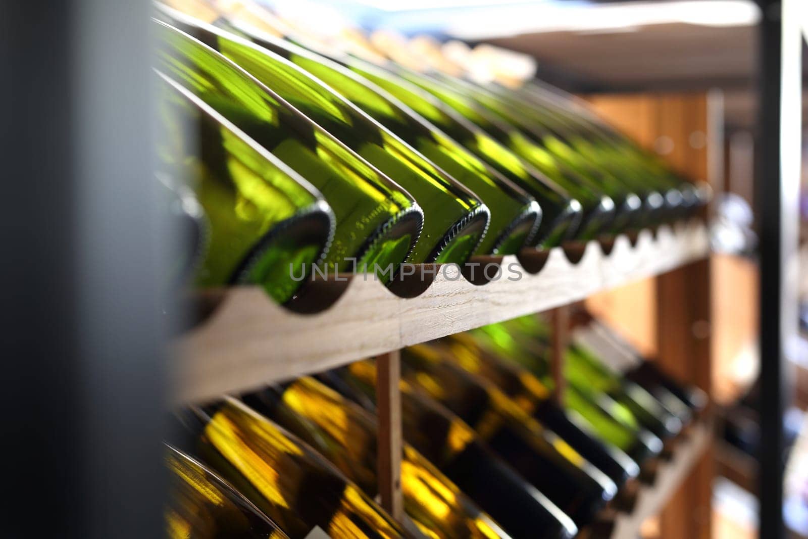 Wine. Man chooses a bottle of wine. Wine cellar