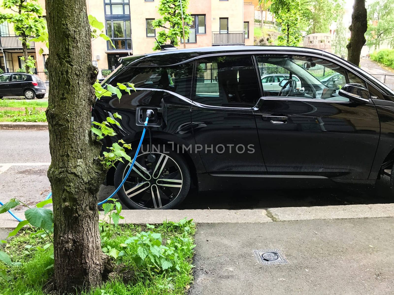 Electric car charging station in Oslo. Eco automobile that sparked a revolution