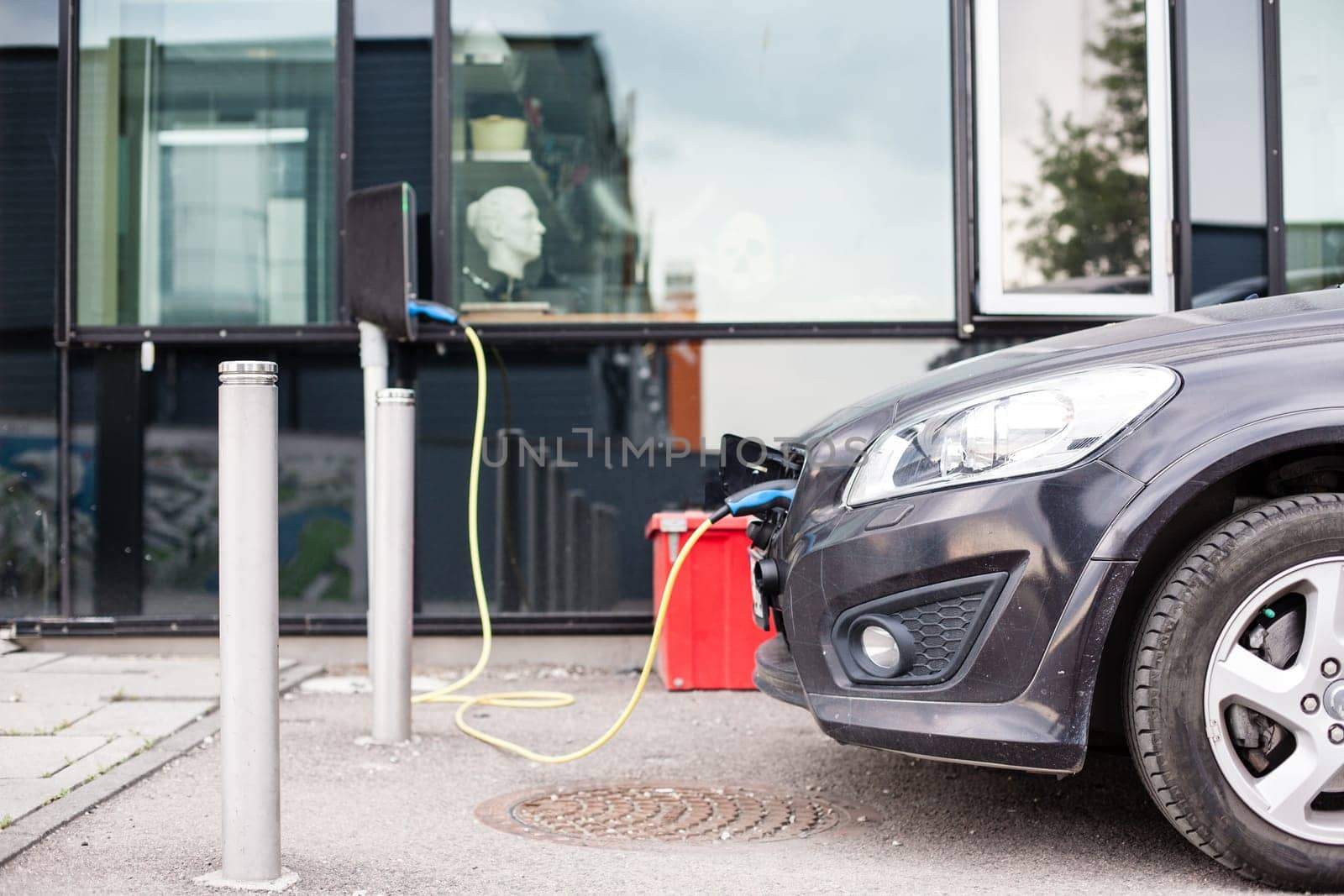 Electric car charging station in Oslo. Eco automobile that sparked a revolution