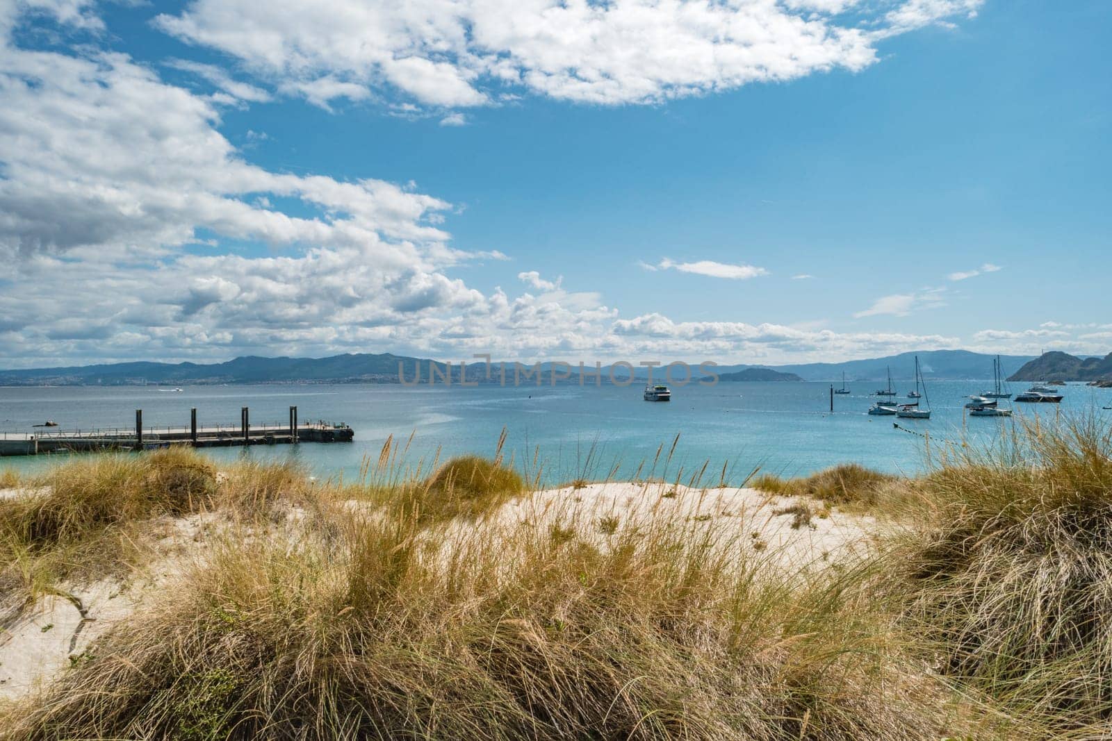 ISLAS CIES, SPAIN - CIRCA SEPTEMBER 2017: S Sand dunes with vegetation along the beach of Playa de Rodas on the Cies Islands of Spain, included in the Atlantic Islands of Galicia National Park.