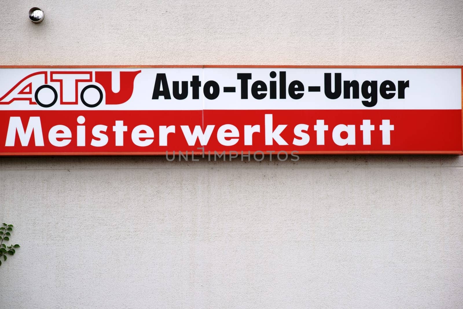 Mainz,Germany - July 16,2017: The company sign of the garage and tire changer ATU,Auto Teile Unger,on the façade of a building on July 16,2017 in Mainz.