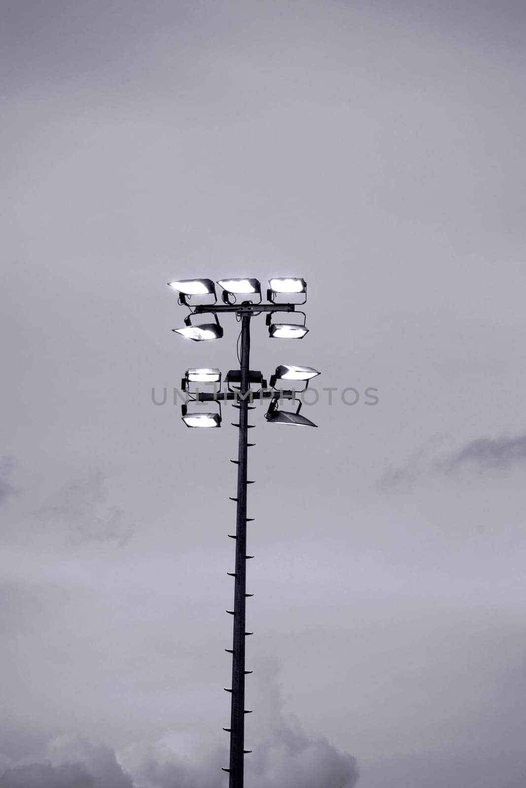Luminous stadium floodlights or mock throws to illuminate a football stadium.