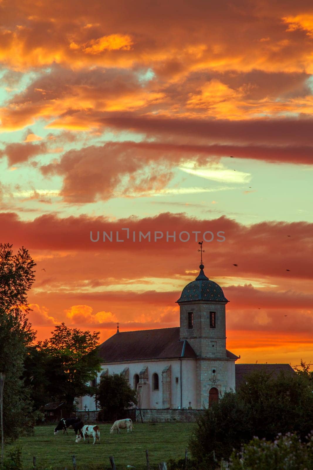 Amazing sunset and colourful sky in a village in France