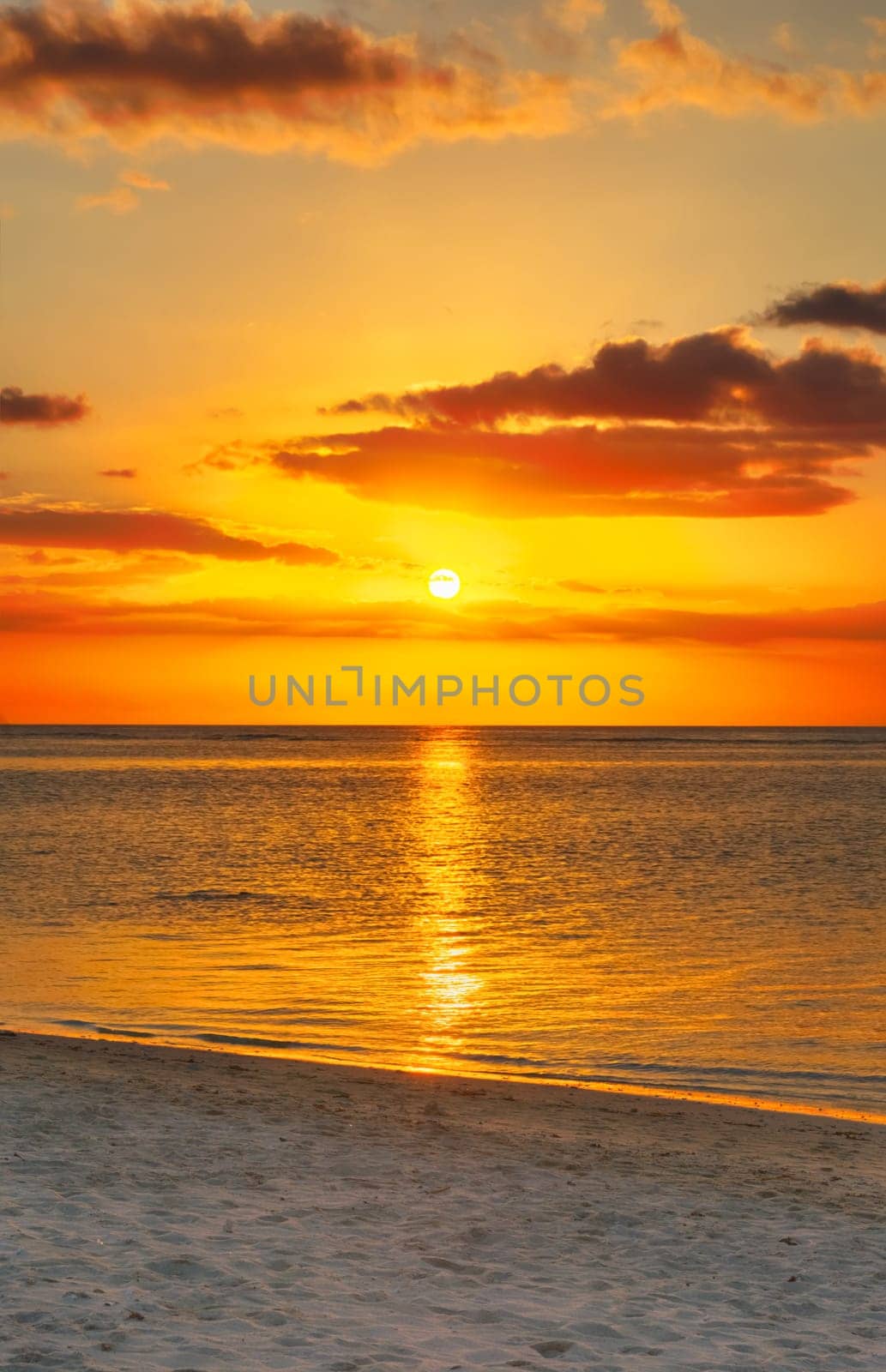 White sandy beach Le Morn  at sunset. Mauritius.