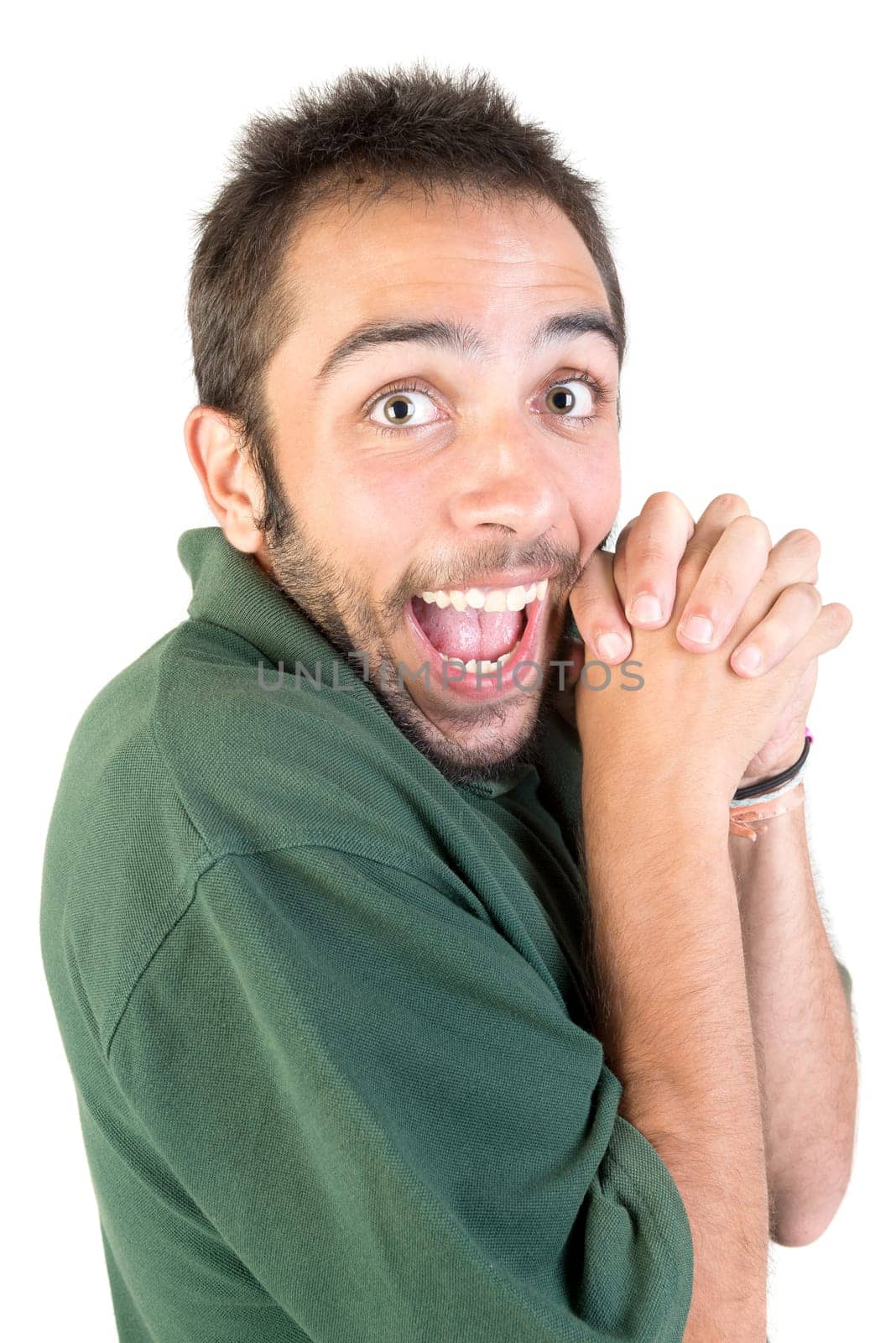 Happy young man making funny faces isolated in white