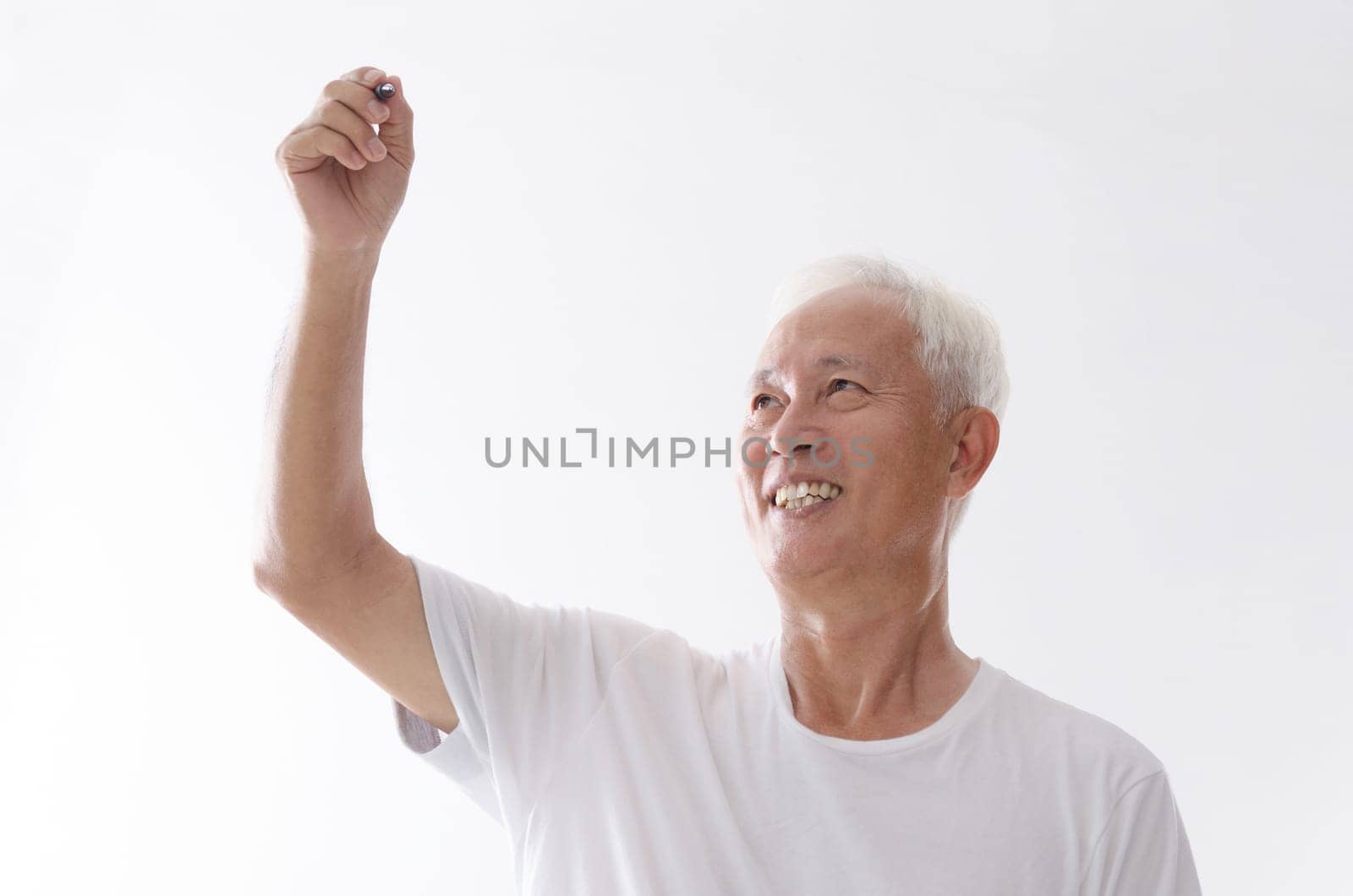 Portrait of old Asian man hand writing on blank space, isolated on white background.