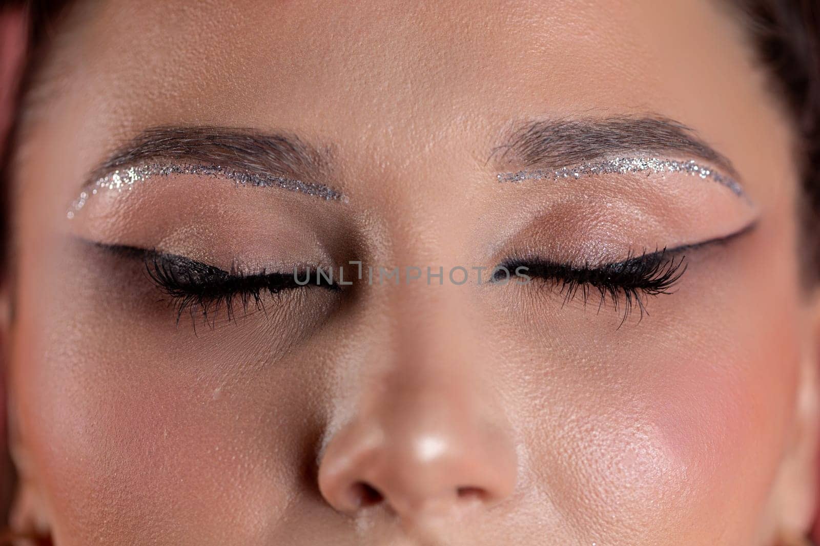 Exceptional stylish eye makeup featuring dazzling glitter, bold eyeliner, and stunning artistry that captivates