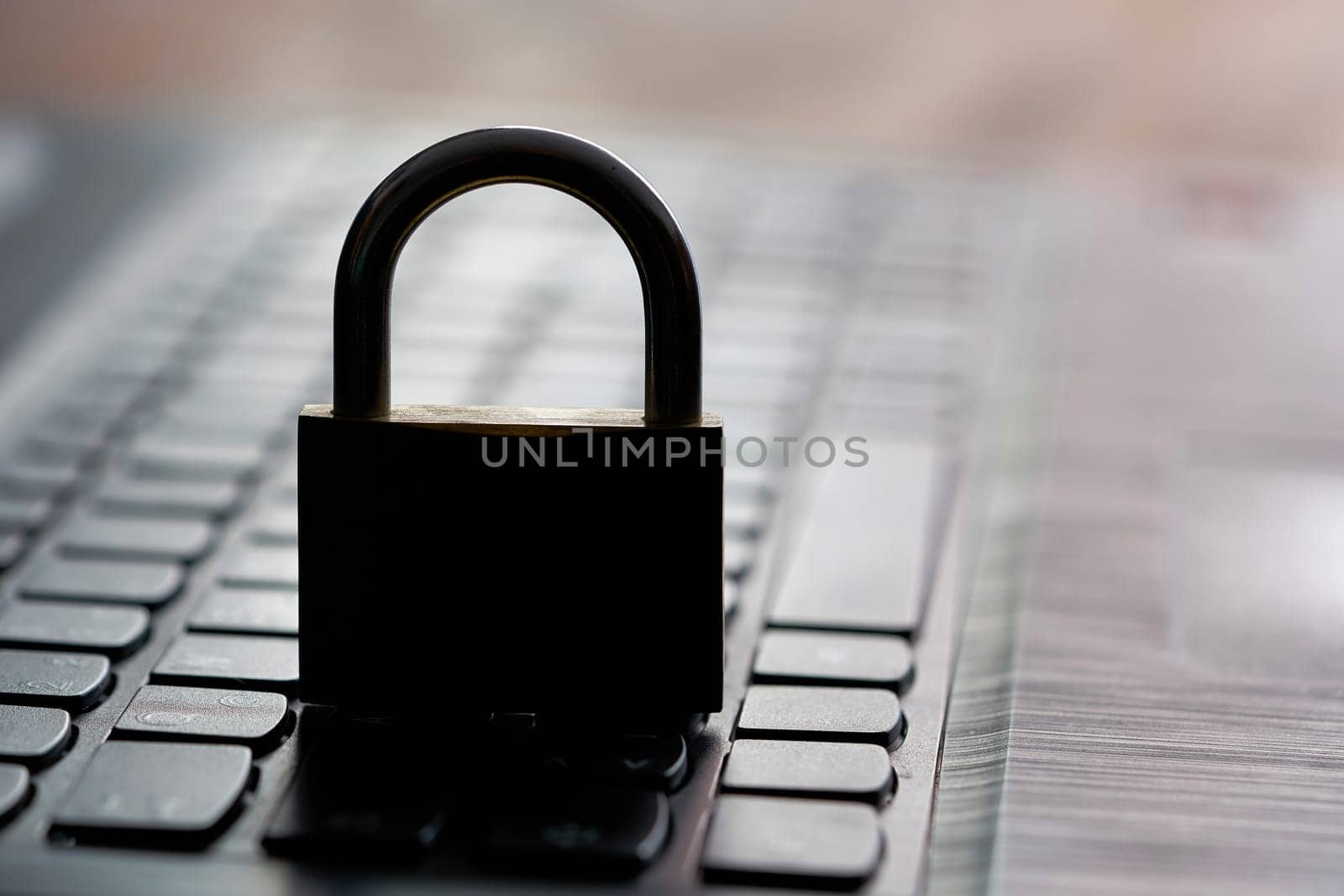 Computer keyboard and padlock as a symbol of security on the Internet
