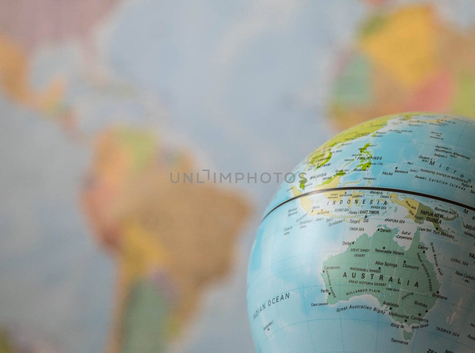 Australia map on a globe with the whole world as background