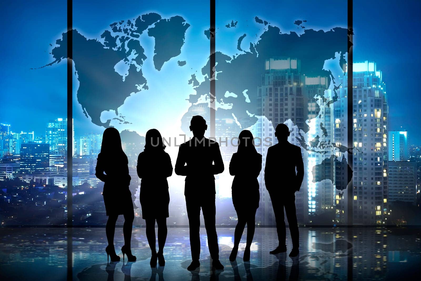 Silhouette of successful business team over world map background