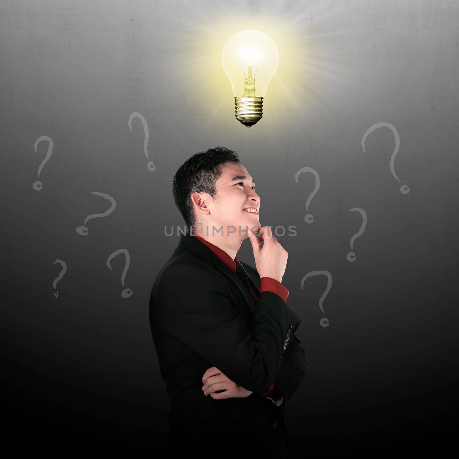 Business man thinking with light bulb top of his head