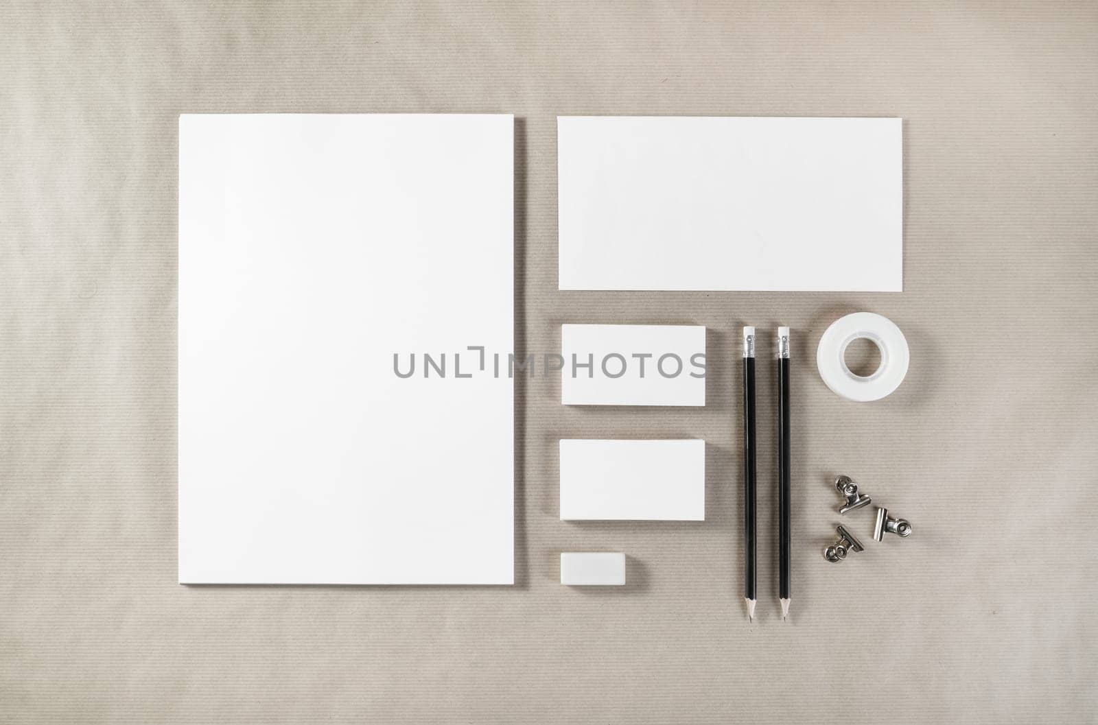 Photo of blank stationery. Corporate identity template on paper background. Mock up for design portfolios. Top view.