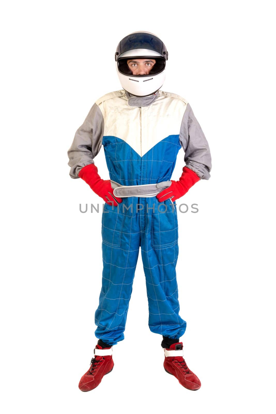 Racing driver posing with helmet isolated in white