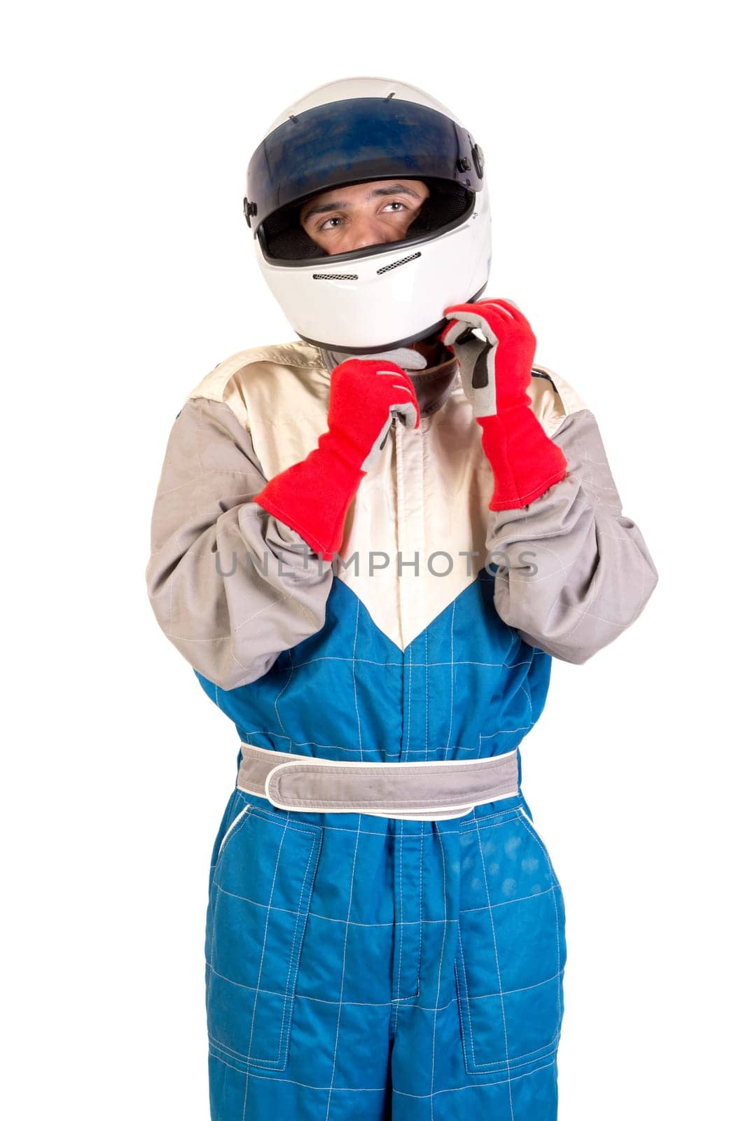 Racing driver posing with helmet isolated in white