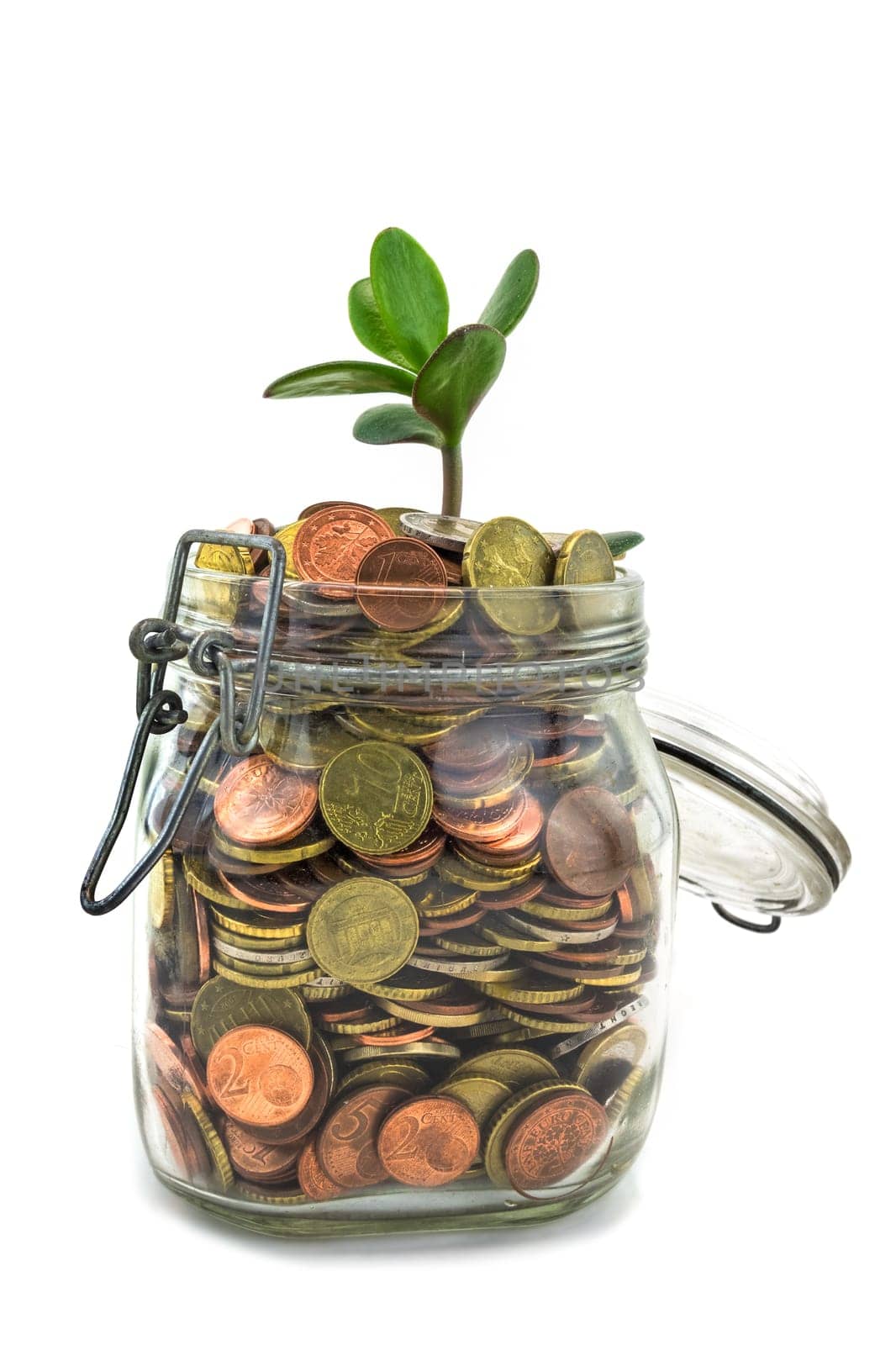 Saving coins in mason jar - concept,growth by saving