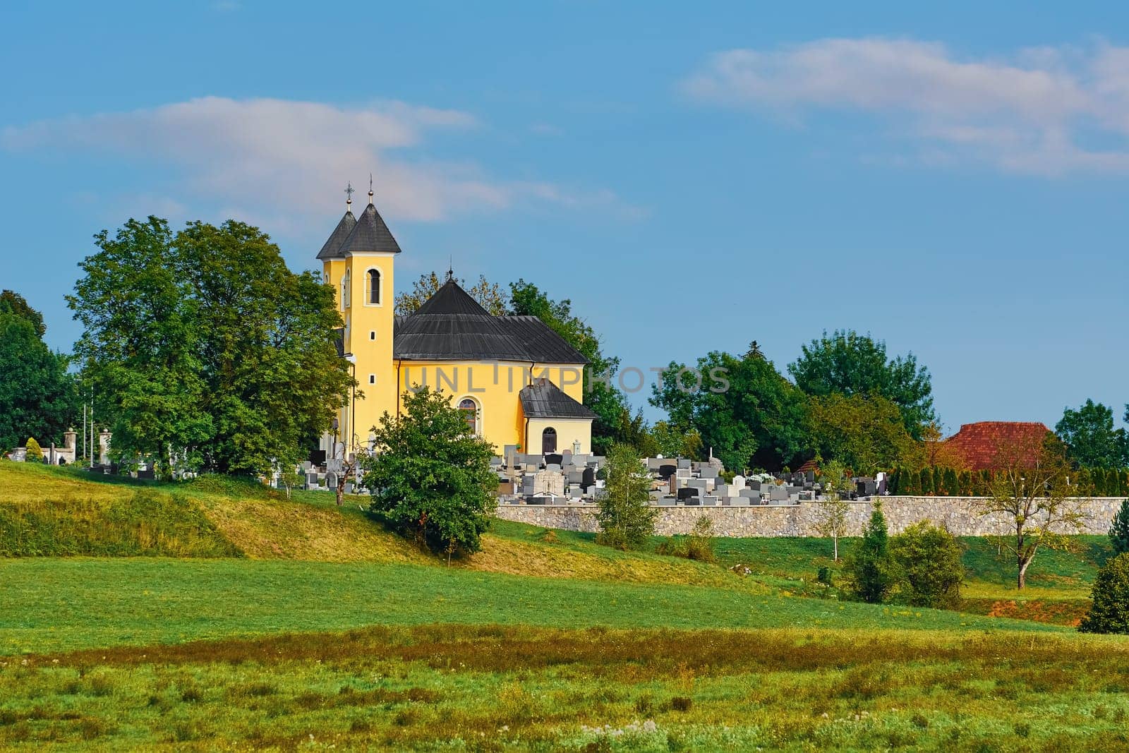 Cemetery Church in Slovenia against Blue Sky