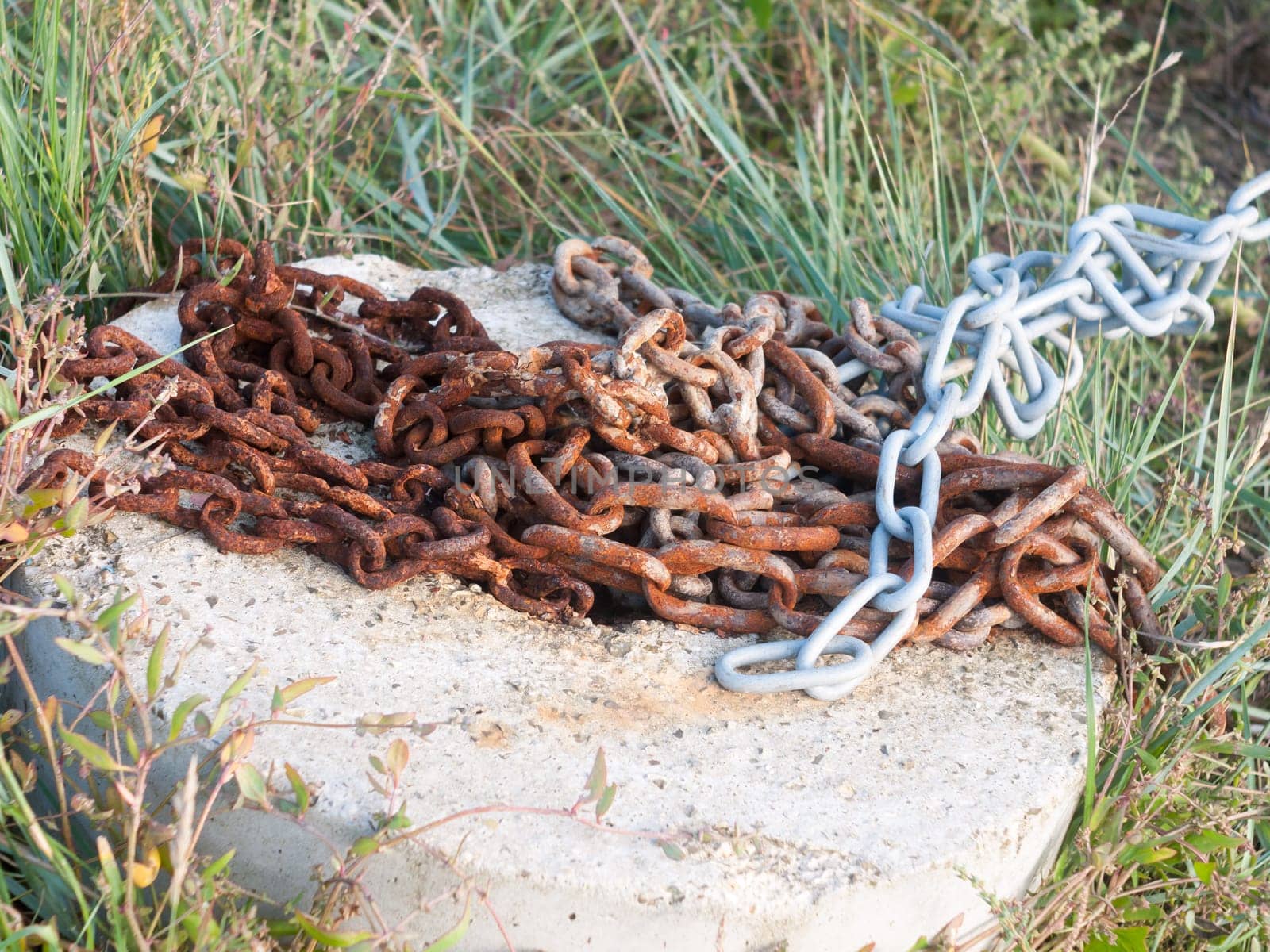 a rusty metal chain on the floor outside  England  Essex