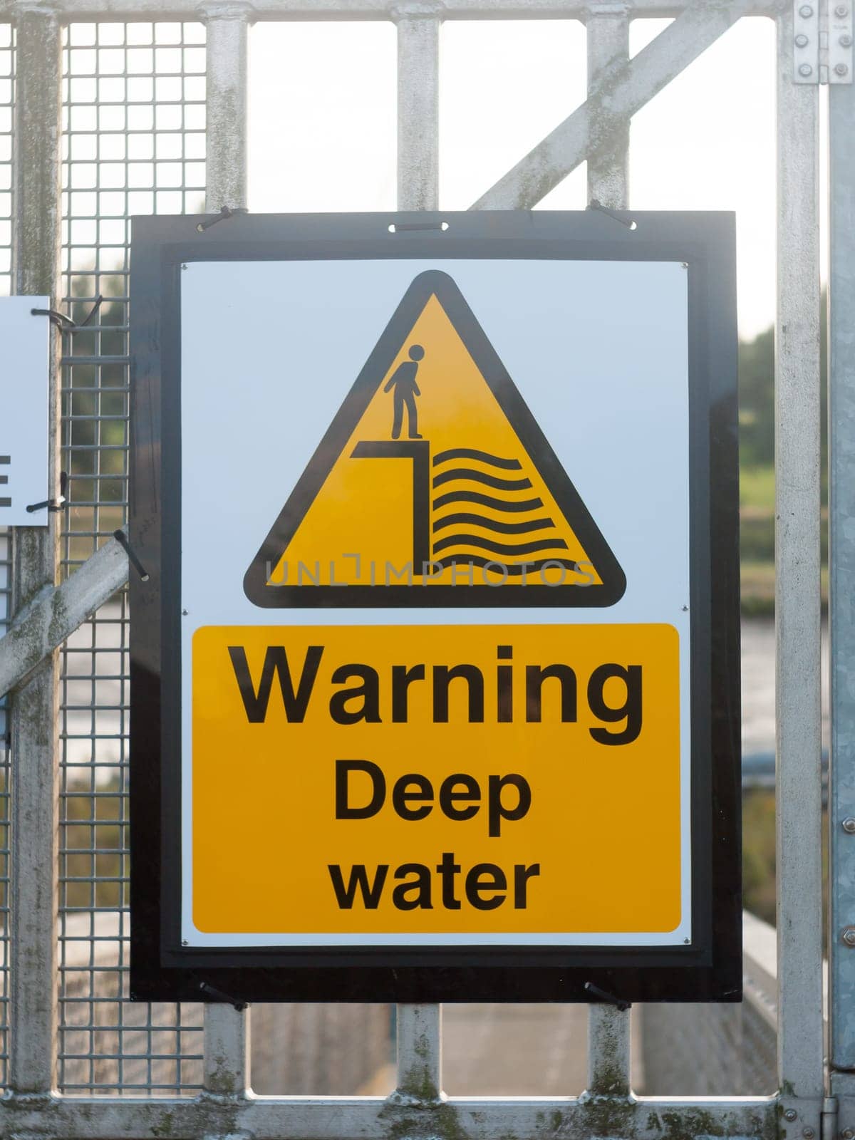 close up yellow sign at dock warning deep water  England  Essex