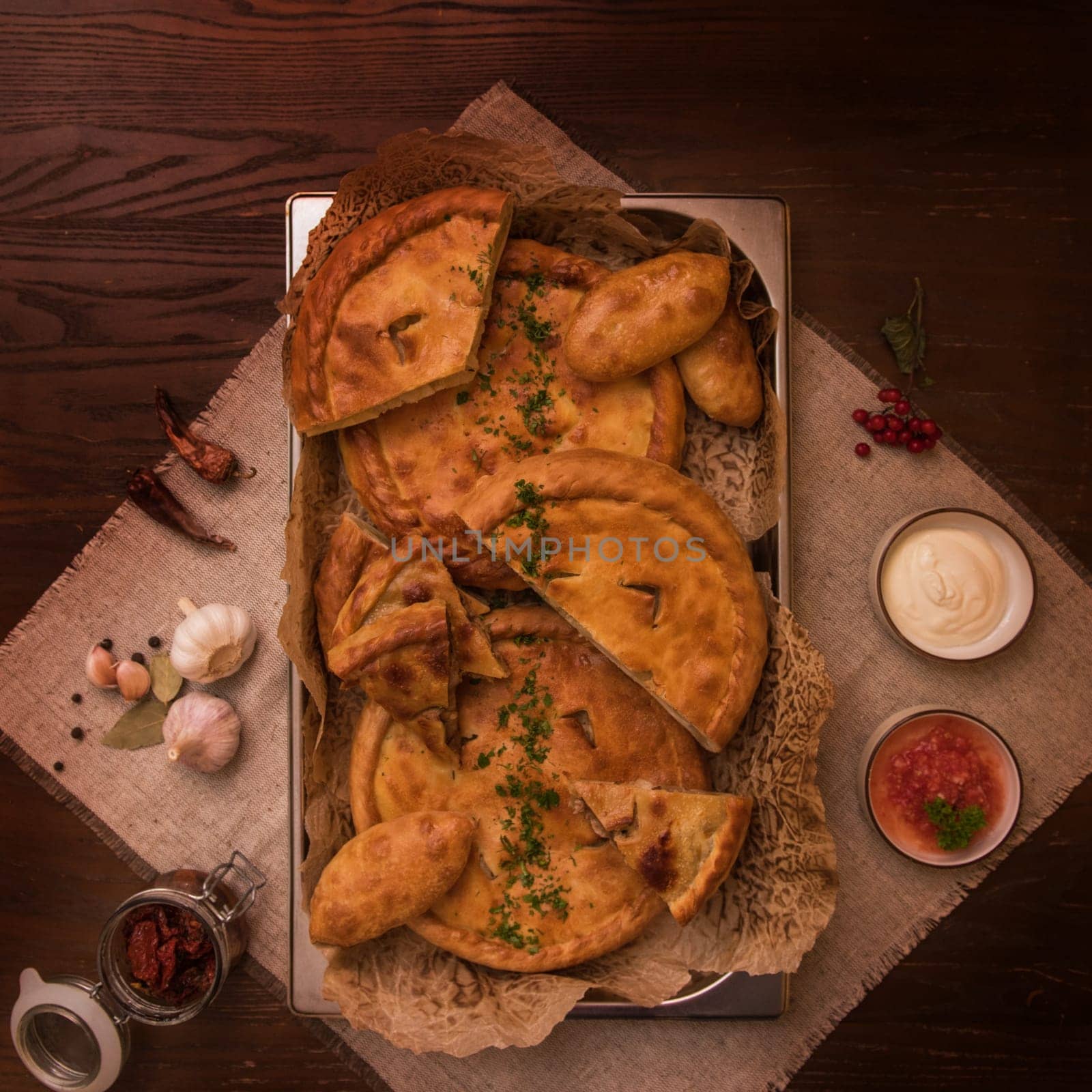 Different pies from meat and vegetables. Freshly baked cakes on a table