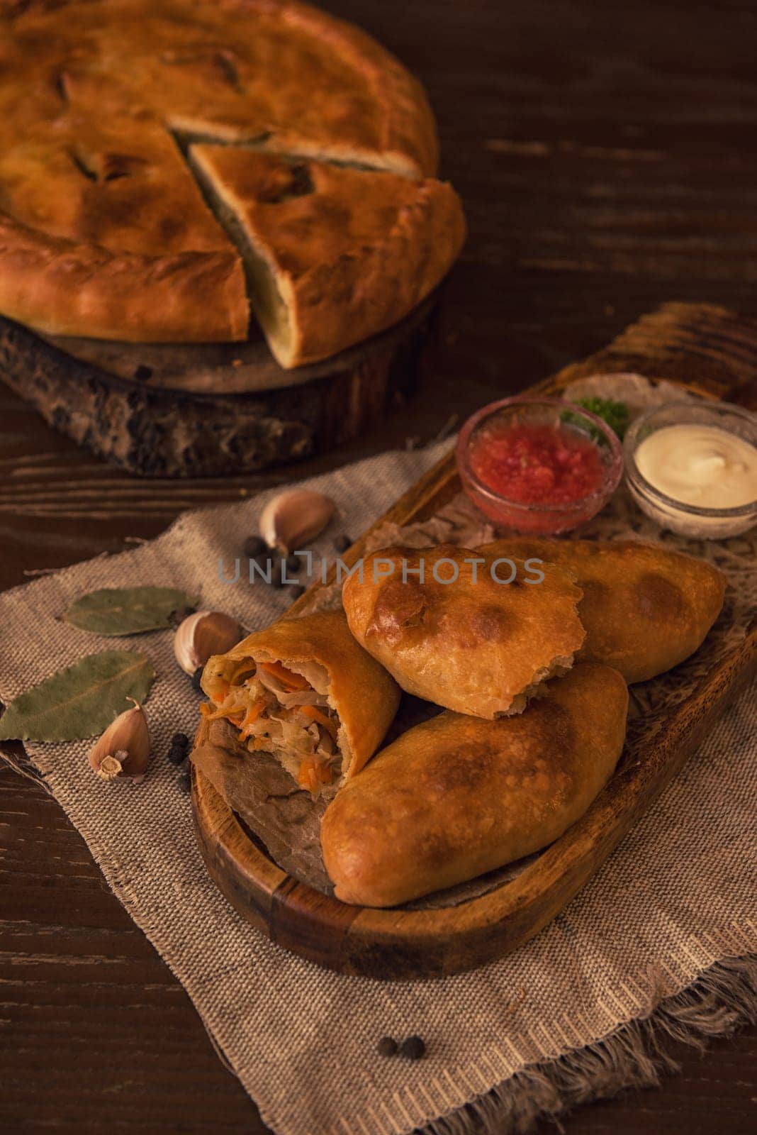 Different pies from meat and vegetables. Freshly baked cakes on a table