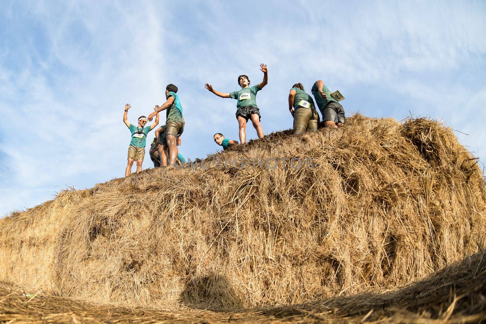 ESTARREJA, PORTUGAL - SEPTEMBER 23: Athletes overcoming the hay osbtacle at the Biorace on september 23, 2017 in Estarreja, Portugal.