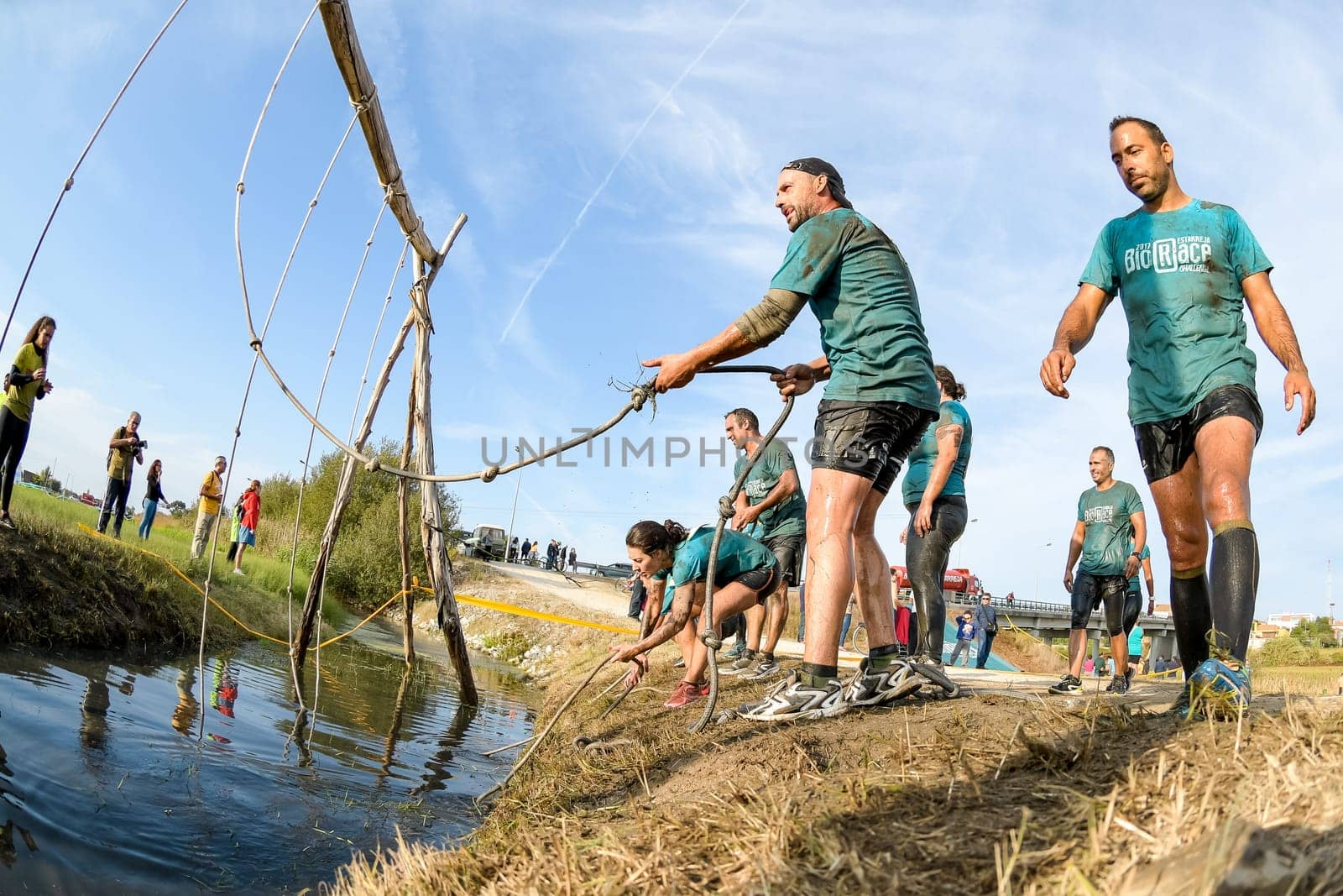 ESTARREJA, PORTUGAL - SEPTEMBER 23: Athletes go through mud and water at the Biorace on september 23, 2017 in Estarreja, Portugal.