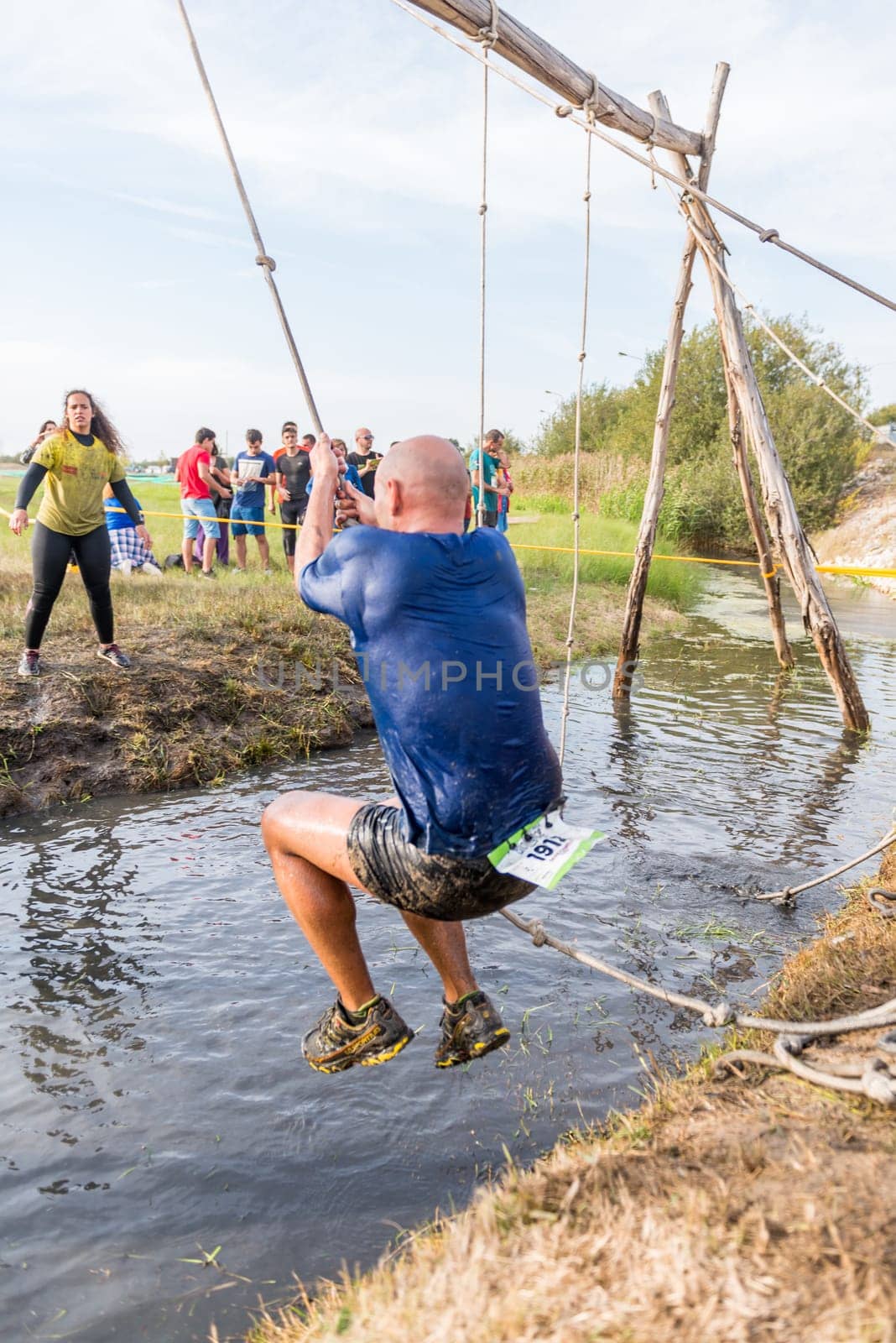 ESTARREJA, PORTUGAL - SEPTEMBER 23: Athlete go through mud and water at the Biorace on september 23, 2017 in Estarreja, Portugal.