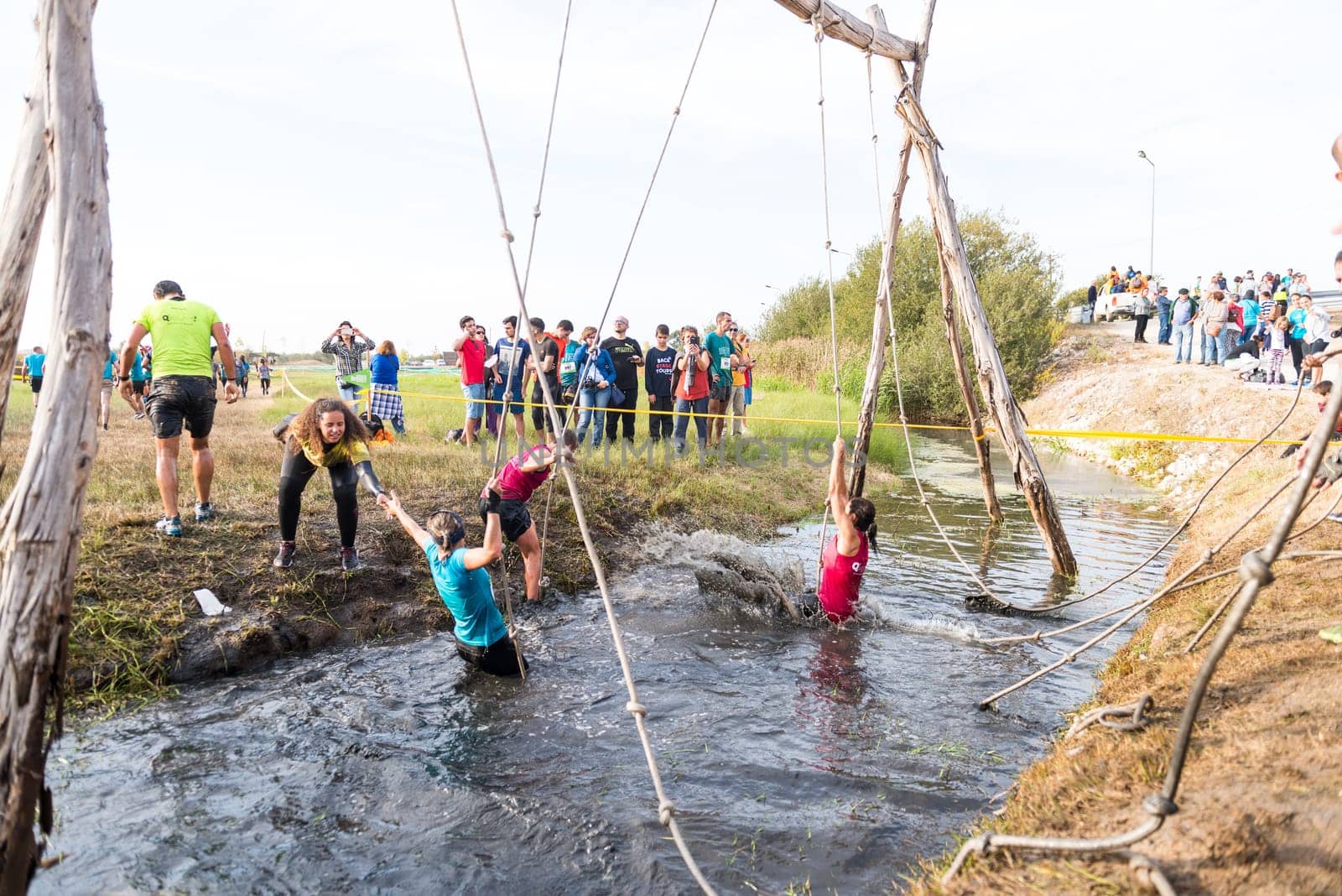 ESTARREJA, PORTUGAL - SEPTEMBER 23: Athletes go through mud and water at the Biorace on september 23, 2017 in Estarreja, Portugal.