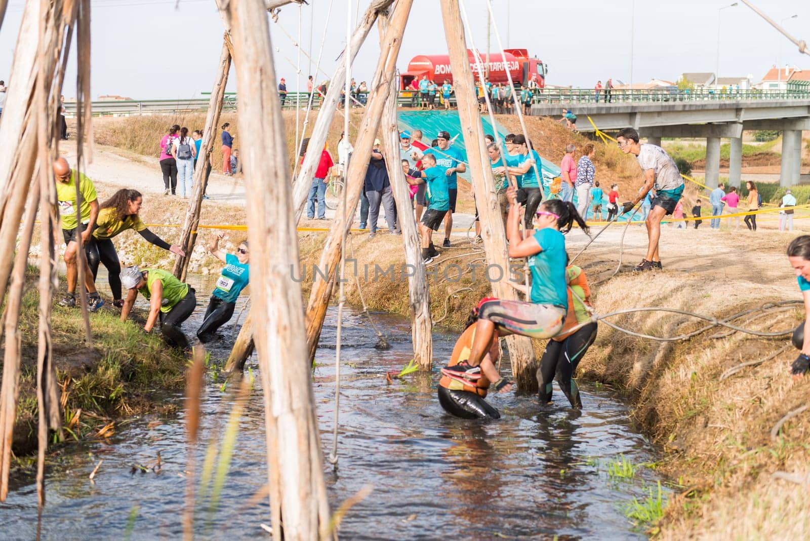ESTARREJA, PORTUGAL - SEPTEMBER 23: Athletes go through mud and water at the Biorace on september 23, 2017 in Estarreja, Portugal.