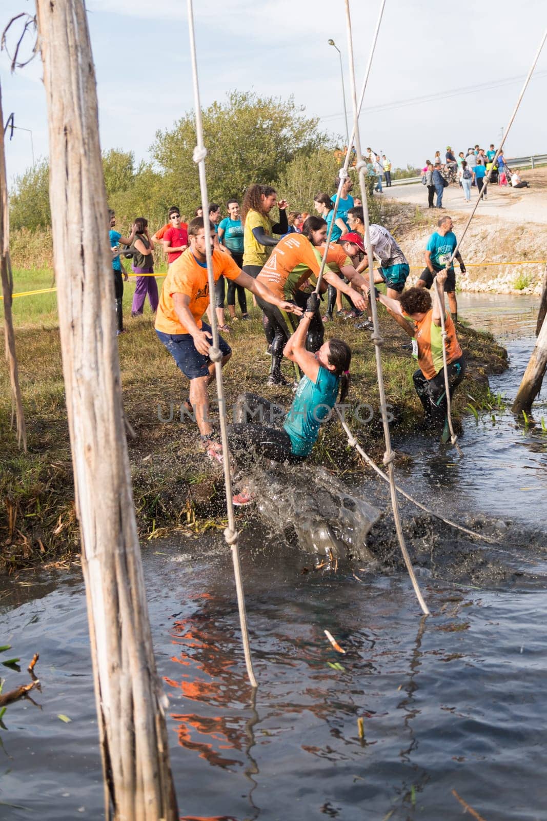 ESTARREJA, PORTUGAL - SEPTEMBER 23: Athletes go through mud and water at the Biorace on september 23, 2017 in Estarreja, Portugal.
