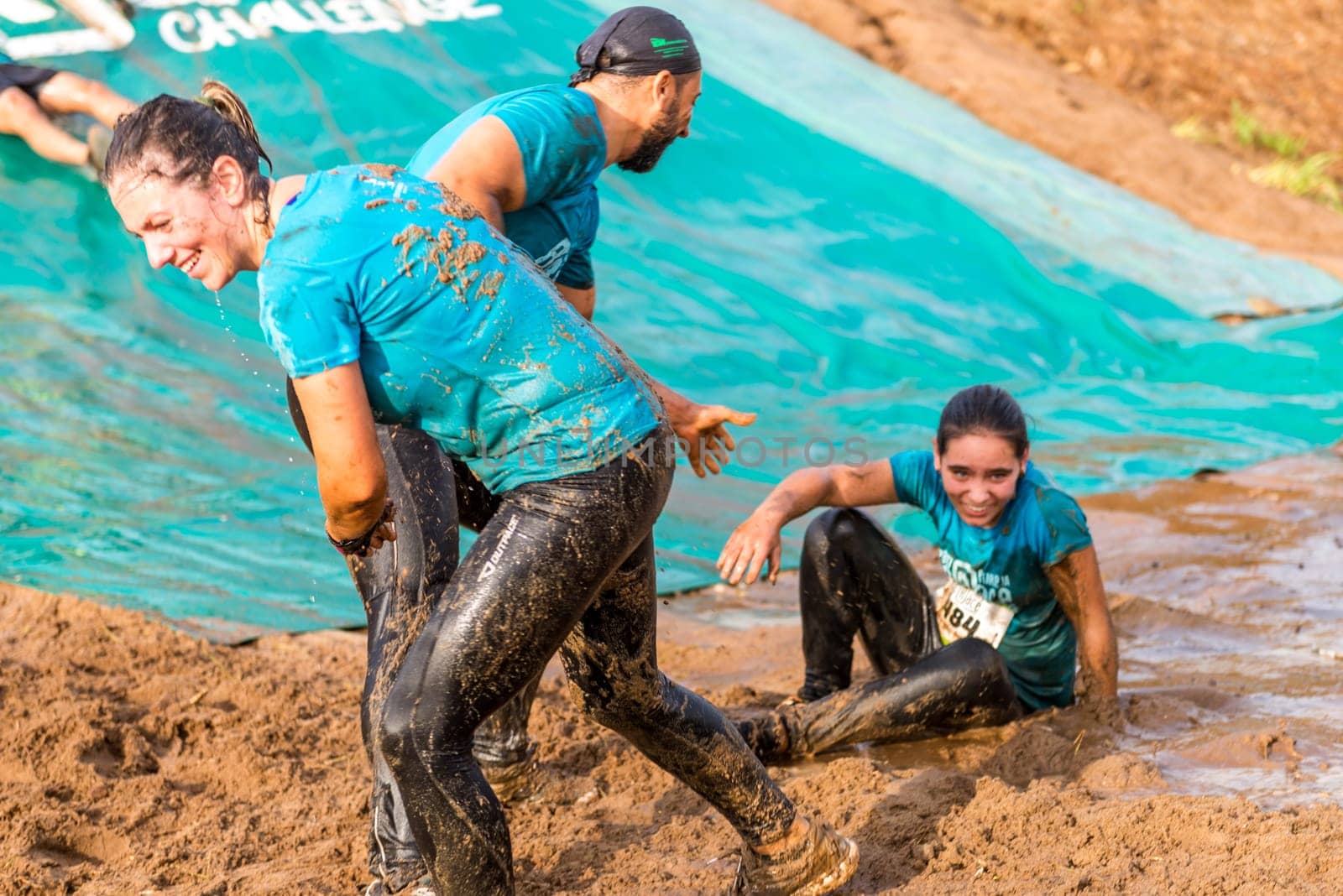 ESTARREJA, PORTUGAL - SEPTEMBER 23: Athletes sliding to mud and water at the Biorace on september 23, 2017 in Estarreja, Portugal.