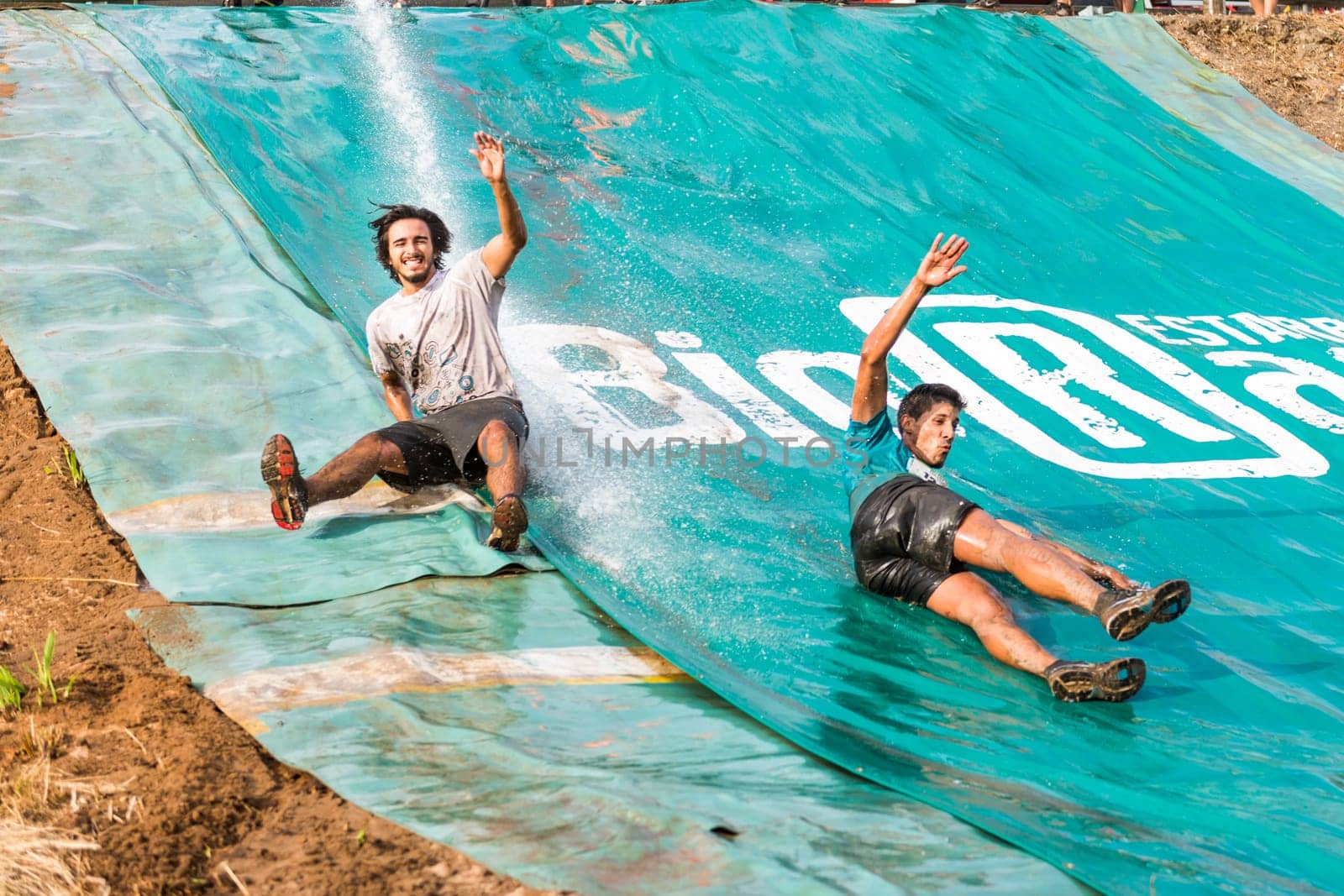 ESTARREJA, PORTUGAL - SEPTEMBER 23: Athletes sliding to mud and water at the Biorace on september 23, 2017 in Estarreja, Portugal.