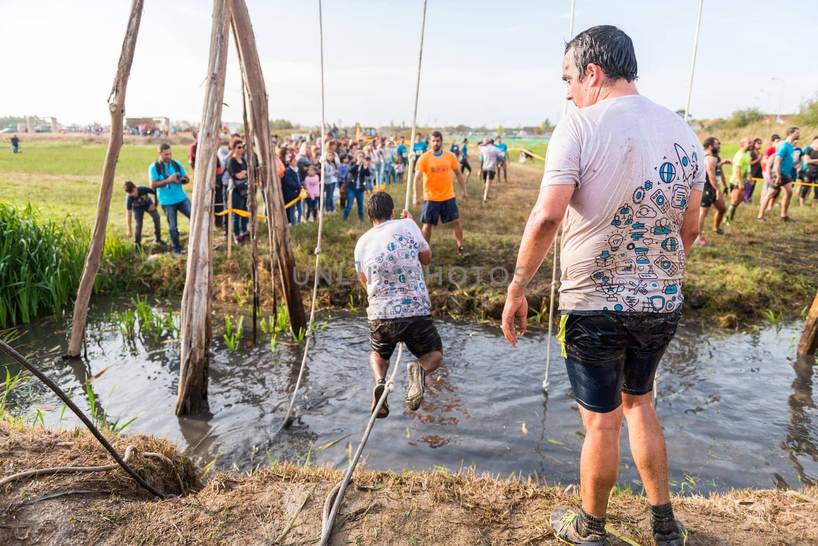 ESTARREJA, PORTUGAL - SEPTEMBER 23: Athletes go through mud and water at the Biorace on september 23, 2017 in Estarreja, Portugal.