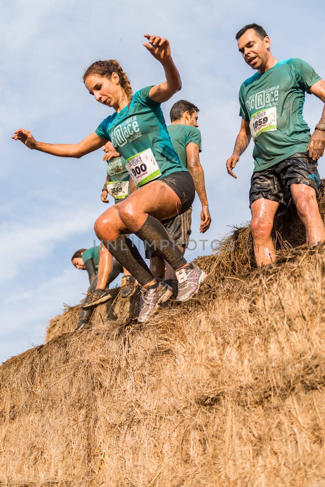 ESTARREJA, PORTUGAL - SEPTEMBER 23: Athletes overcoming the hay osbtacle at the Biorace on september 23, 2017 in Estarreja, Portugal.