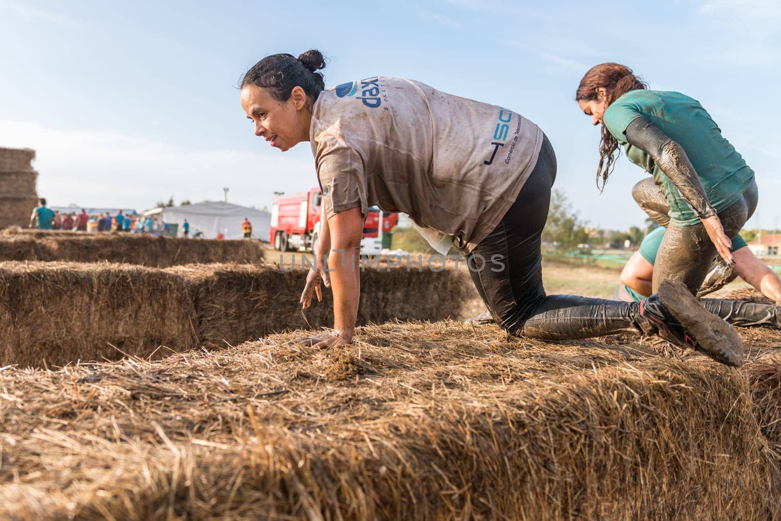 ESTARREJA, PORTUGAL - SEPTEMBER 23: Athletes overcoming the hay osbtacle at the Biorace on september 23, 2017 in Estarreja, Portugal.