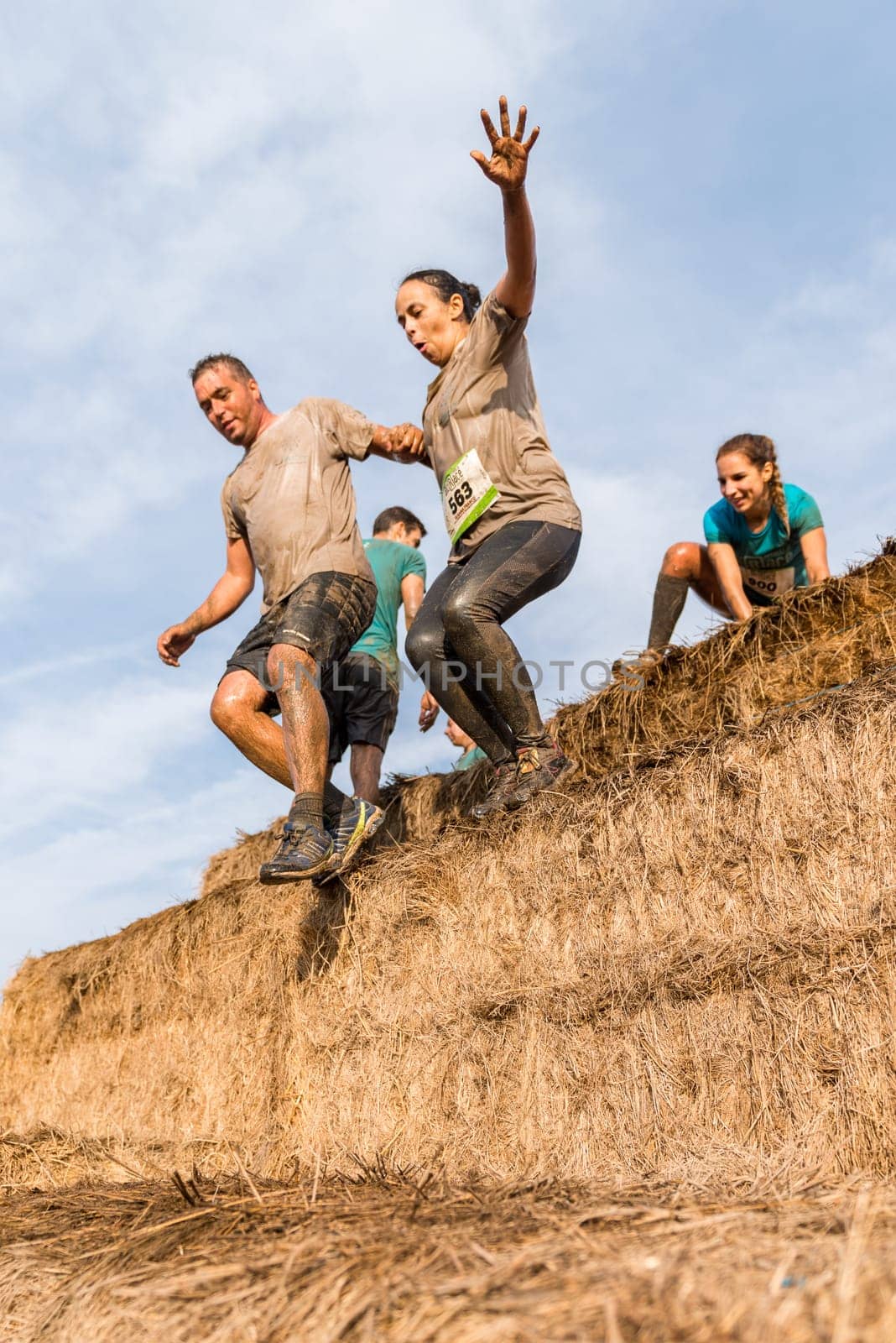 ESTARREJA, PORTUGAL - SEPTEMBER 23: Athletes overcoming the hay osbtacle at the Biorace on september 23, 2017 in Estarreja, Portugal.