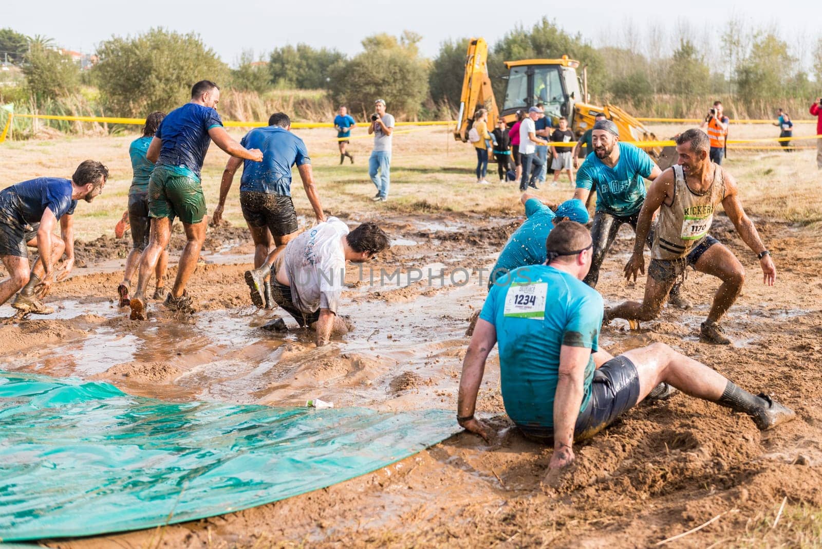 ESTARREJA, PORTUGAL - SEPTEMBER 23: Athletes sliding to mud and water at the Biorace on september 23, 2017 in Estarreja, Portugal.