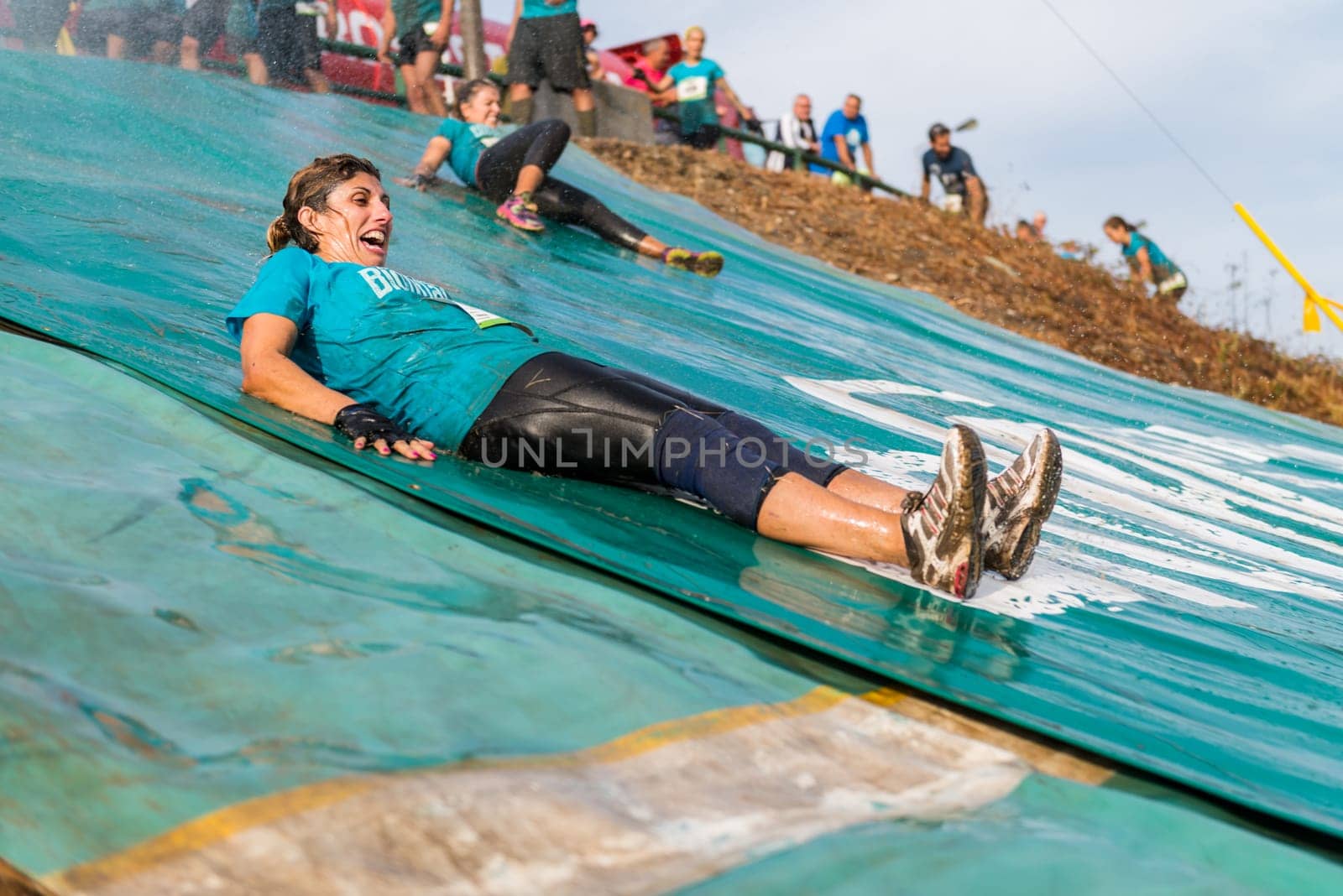 ESTARREJA, PORTUGAL - SEPTEMBER 23: Athletes sliding to mud and water at the Biorace on september 23, 2017 in Estarreja, Portugal.