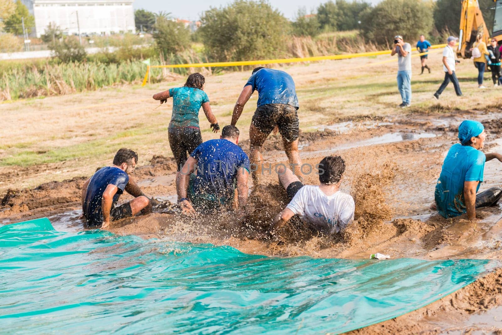 ESTARREJA, PORTUGAL - SEPTEMBER 23: Athletes sliding to mud and water at the Biorace on september 23, 2017 in Estarreja, Portugal.