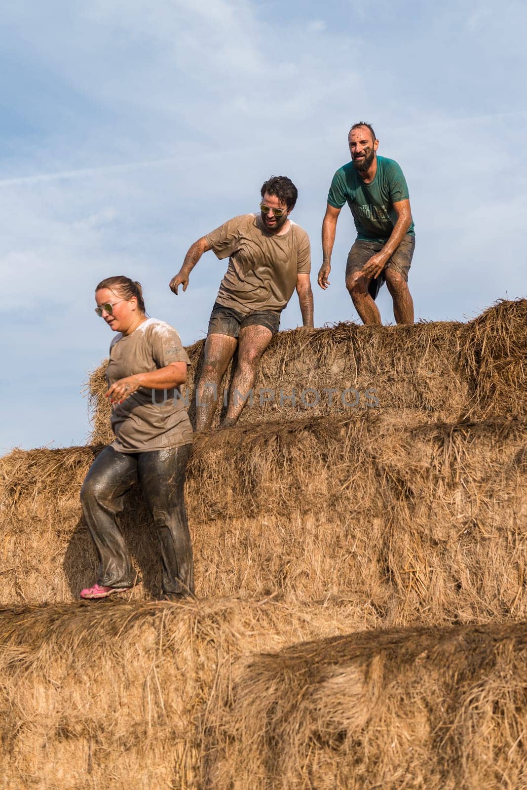 ESTARREJA, PORTUGAL - SEPTEMBER 23: Athletes overcoming the hay osbtacle at the Biorace on september 23, 2017 in Estarreja, Portugal.