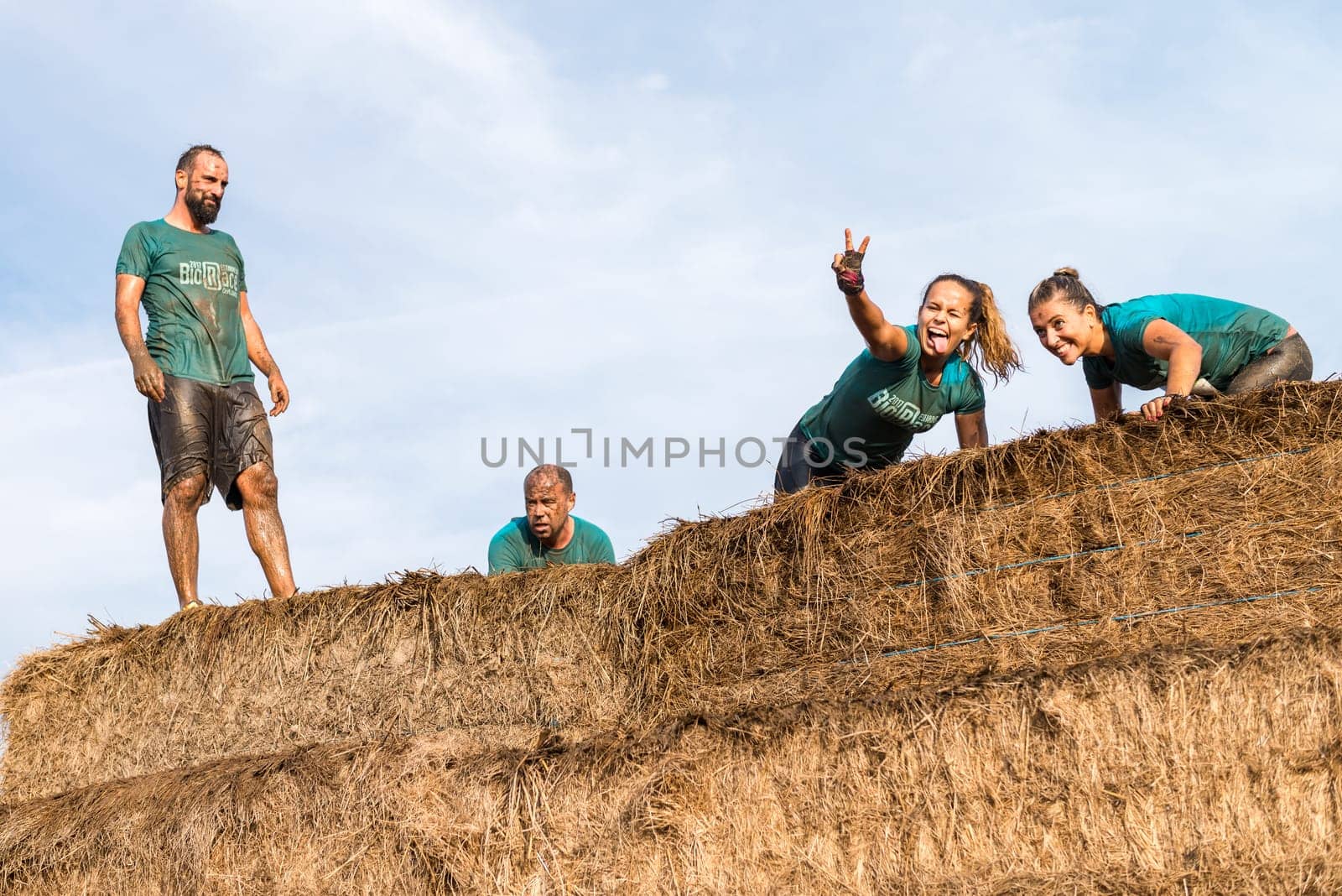 ESTARREJA, PORTUGAL - SEPTEMBER 23: Athletes overcoming the hay osbtacle at the Biorace on september 23, 2017 in Estarreja, Portugal.