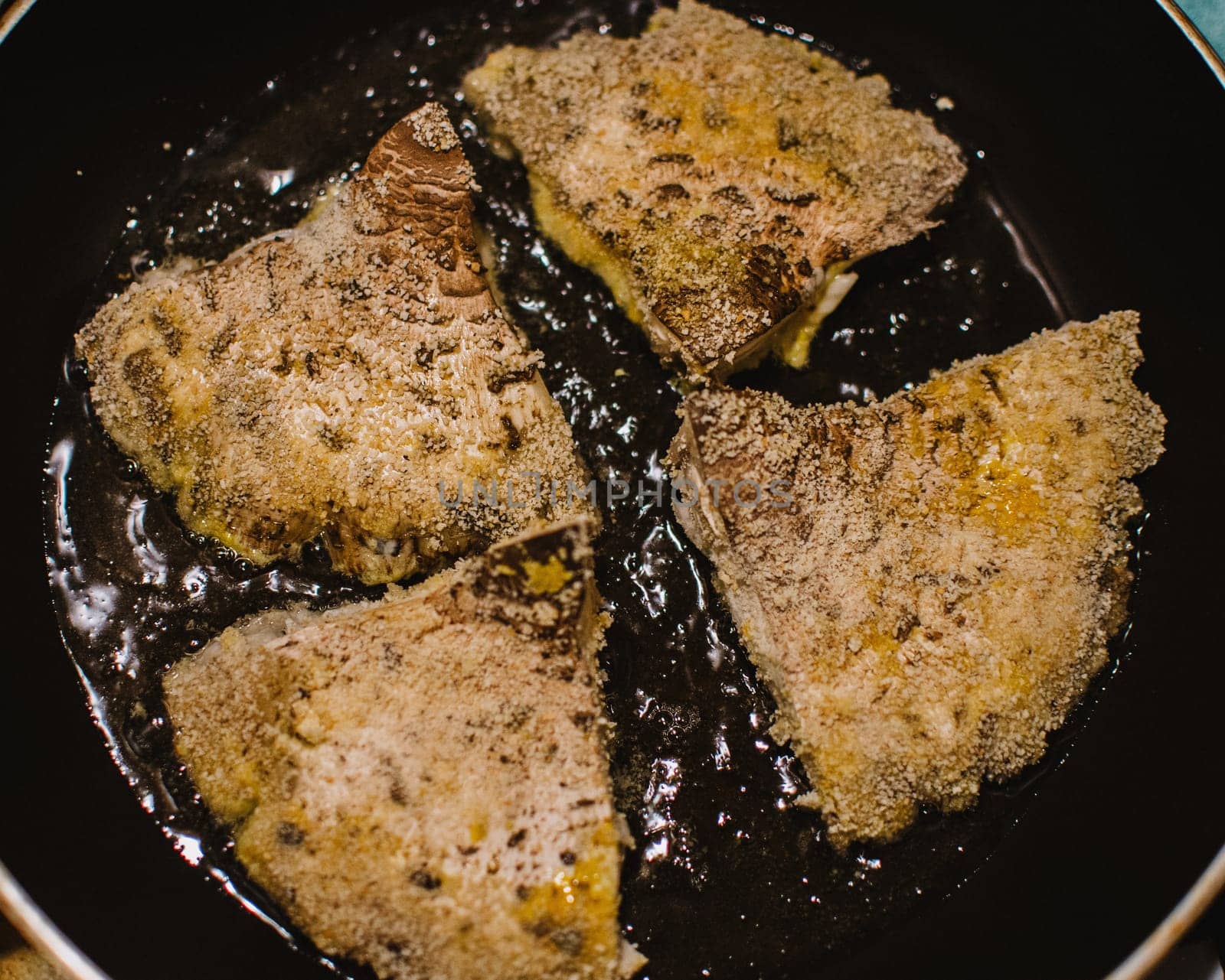 mushroom chops from macrolepiota procera on a pan