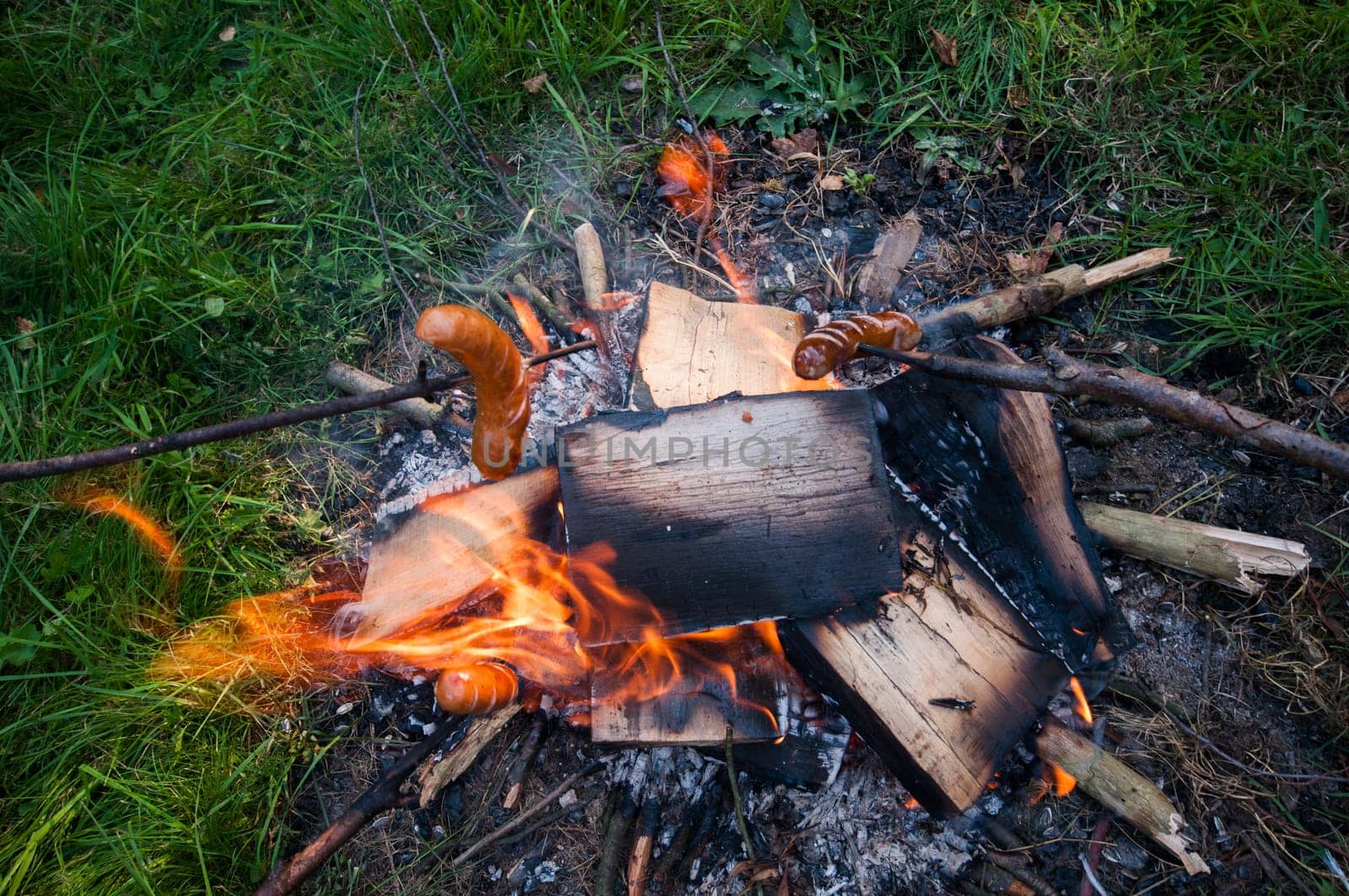 sausage on a stick,fireplace at the campsite