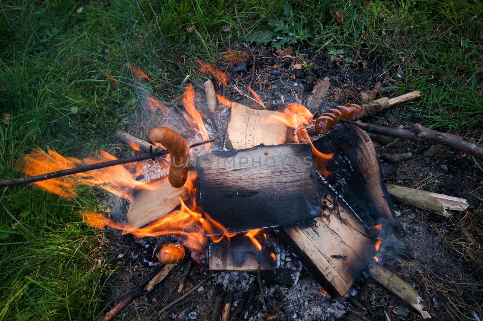 sausage on a stick,fireplace at the campsite