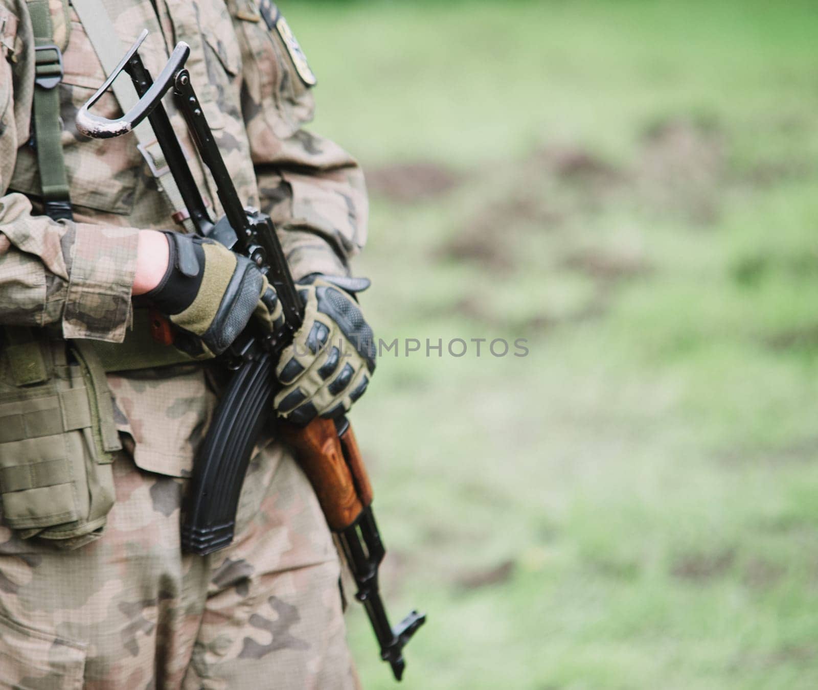 close up on soldier with machine gun