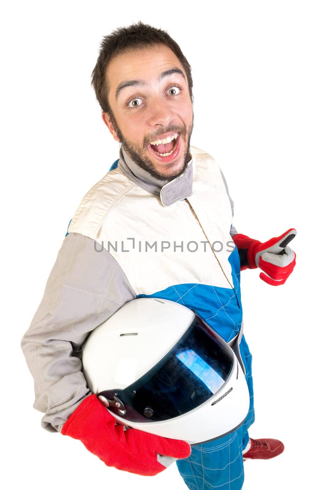 Racing driver posing with helmet isolated in white