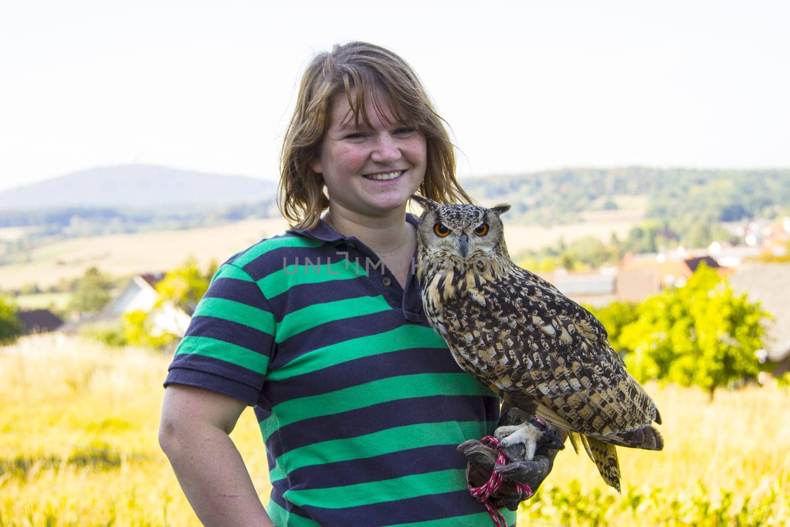 Young female keeps Indian eagle owl female