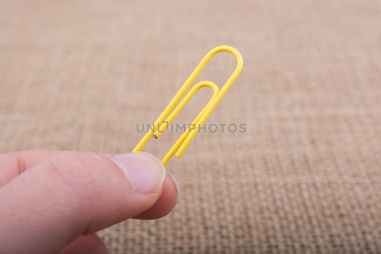 Colorful clip in hnad on a linen canvas